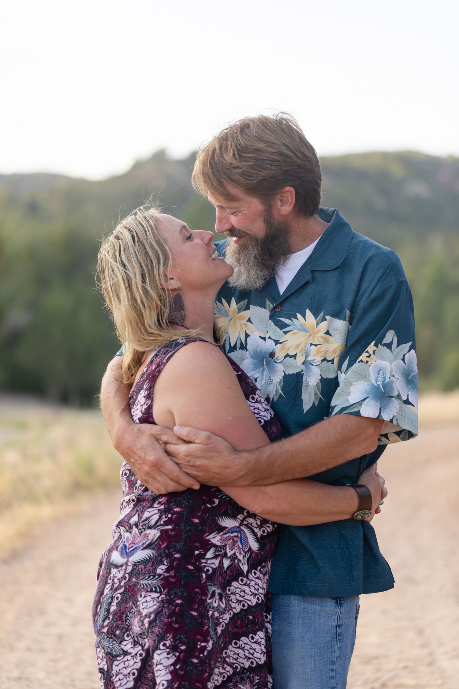 Couple sharing an intimate moment during golden hour.