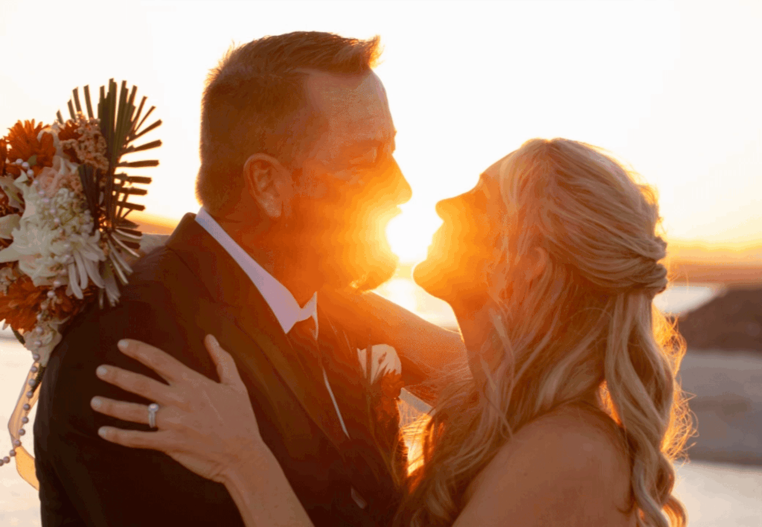 Bride and groom sharing a romantic lakeside moment at sunset, Lake Havasu wedding at The Riviera Marina.
