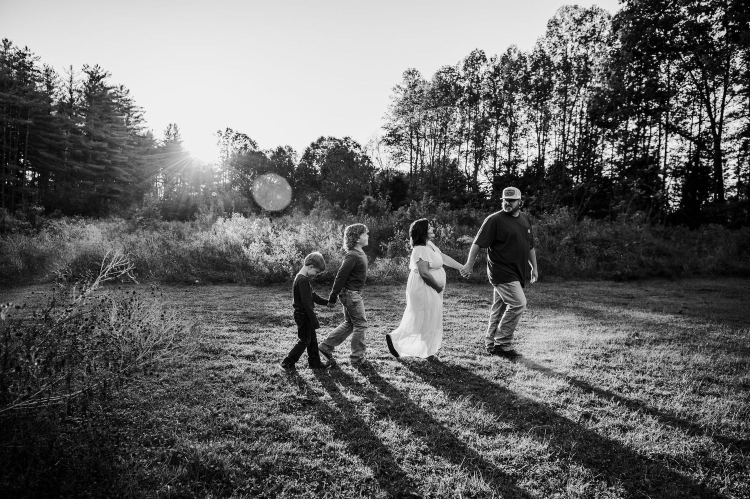 Black and white family walking down a country road at Otter Creek Brandenburg KY