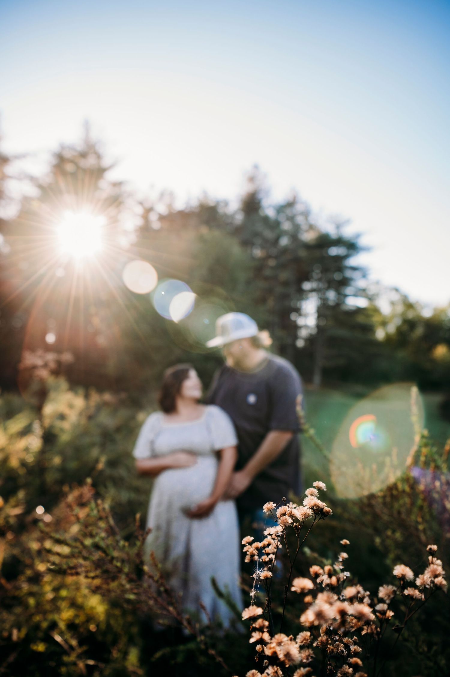 Fall maternity photos at Otter Creek Brandenburg KY with golden sunlight and soft lens flare