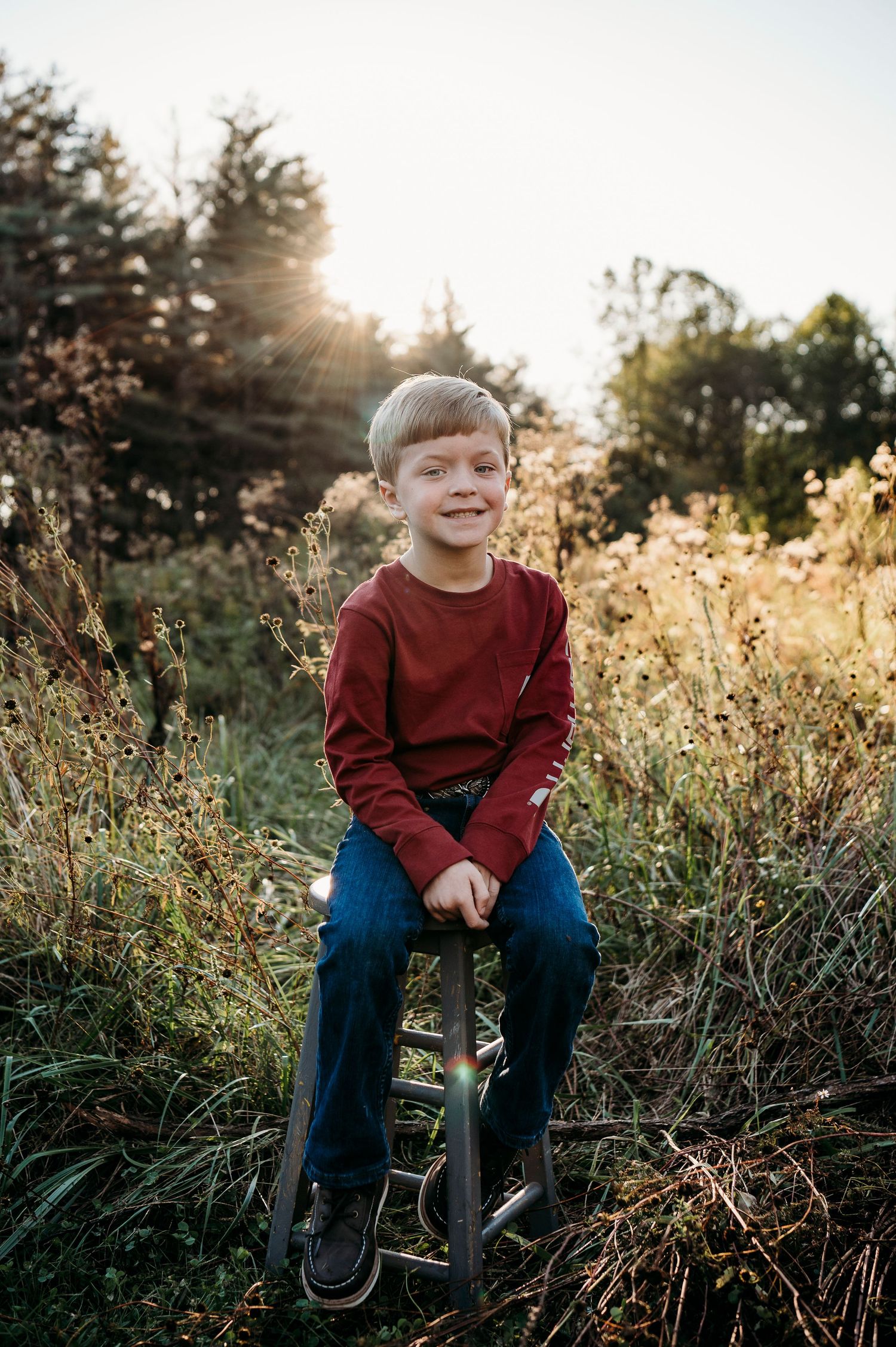 Child smiling during outdoor fall family session at Otter Creek Brandenburg KY