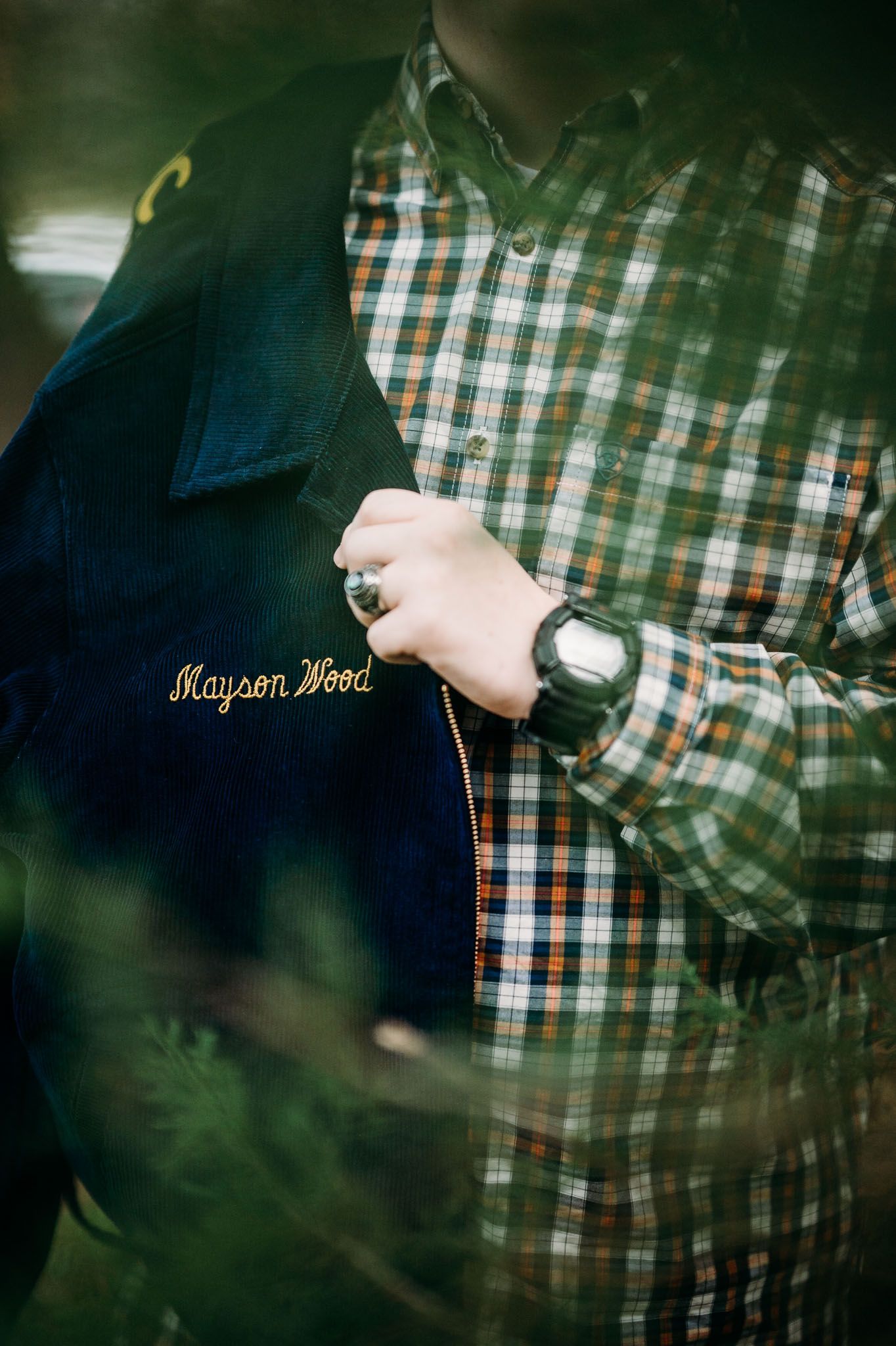 Mayson holds his FFA jacket during his Meade County senior session with ninefifteenphoto