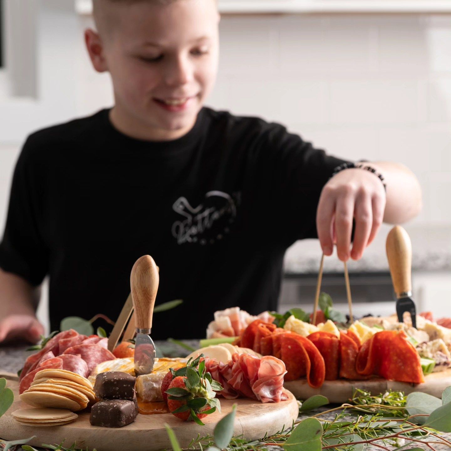 Lifestyle photo of boy decorating cake at home, ninefifteenphoto Brandenburg KY lifestyle family photographer.