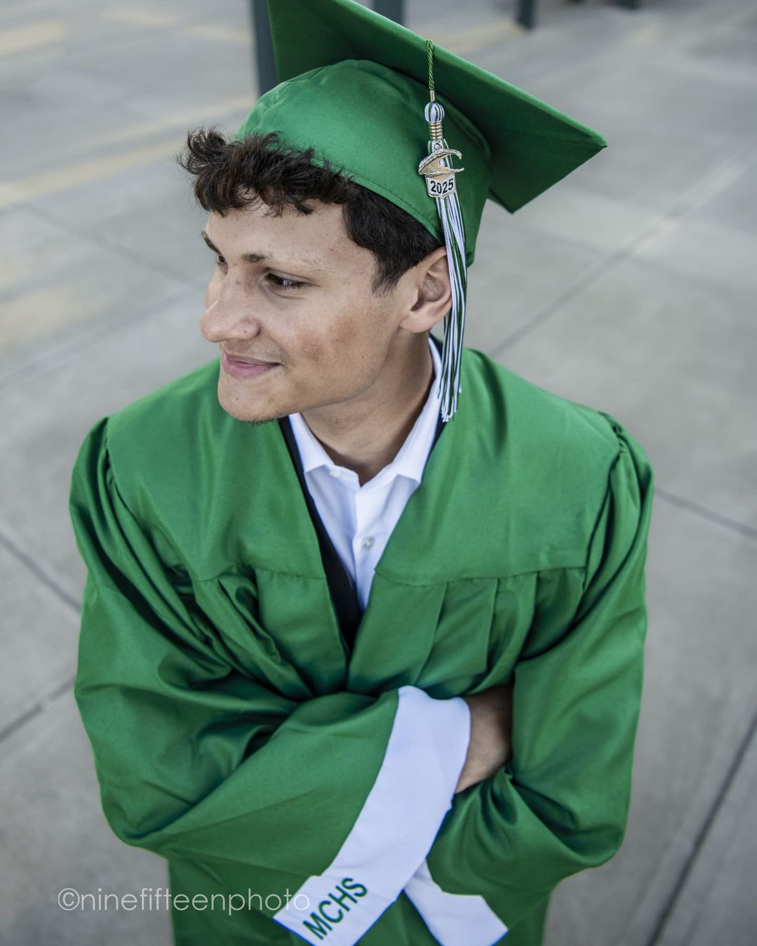 Senior graduation photo in cap and gown taken outdoors in Kentucky by ninefifteenphoto for Class of 2025.