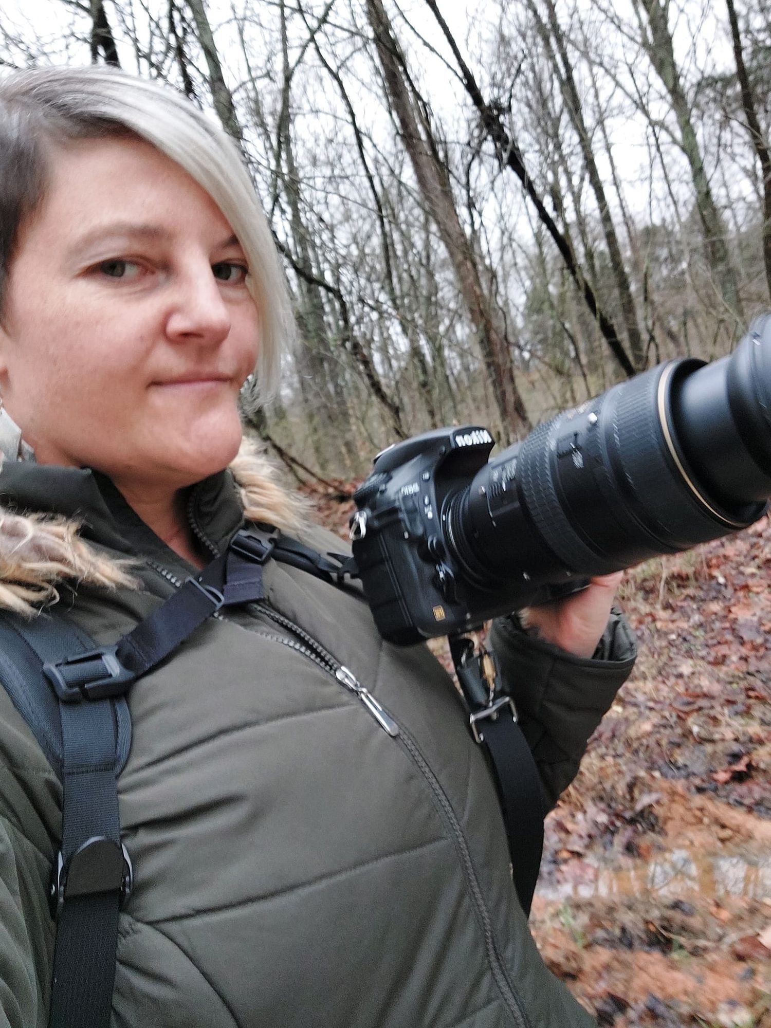 Behind the scenes portrait of ninefifteenphoto photographer capturing natural moments outdoors in Brandenburg KY