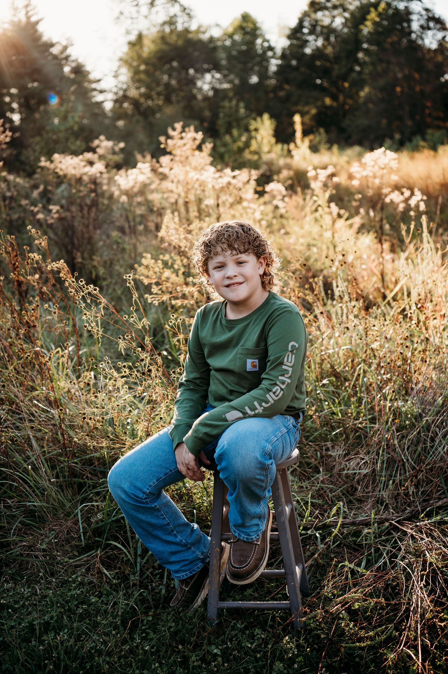 Child smiling during outdoor fall family session at Otter Creek Brandenburg KY