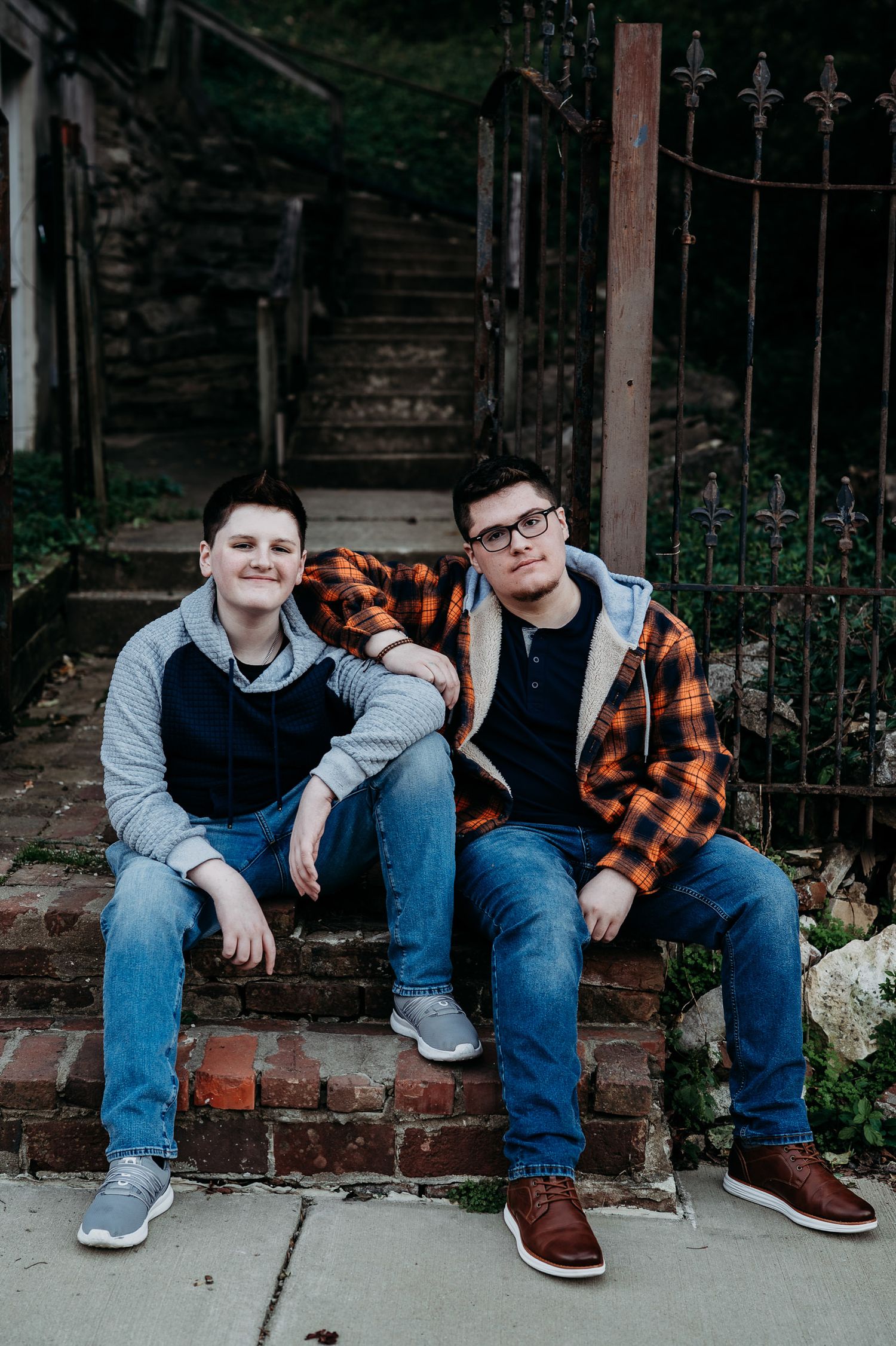 Luca and his brother laughing together during his fall senior photo session in Brandenburg KY.