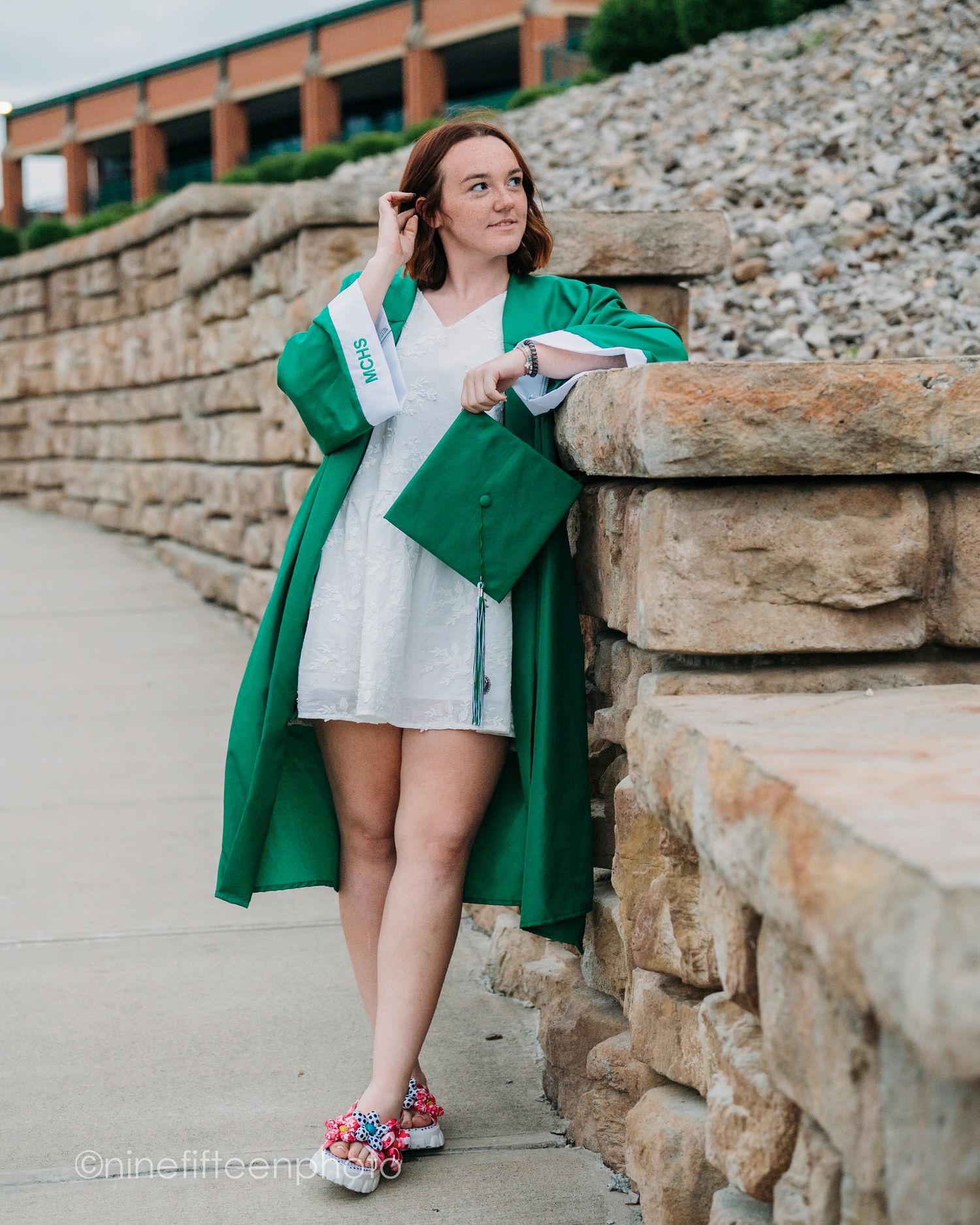 Senior graduation photo in cap and gown taken outdoors in Kentucky by ninefifteenphoto for Class of 2025.