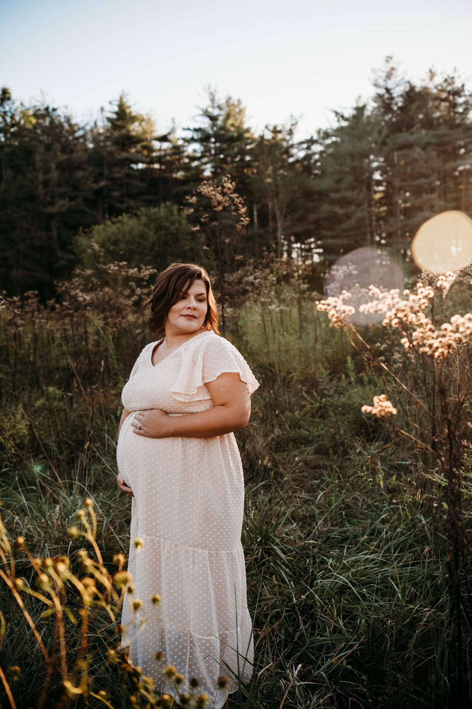 Expecting mother in white dress surrounded by golden light Otter Creek Brandenburg KY