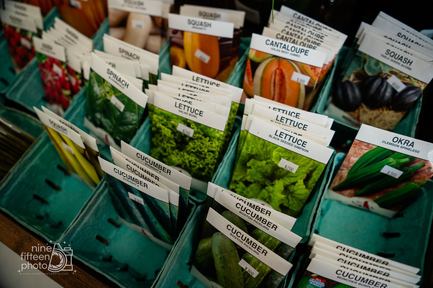 Seed packets for lettuce, squash, cucumber, okra, and more displayed at the farm market in Brandenburg, Kentucky.