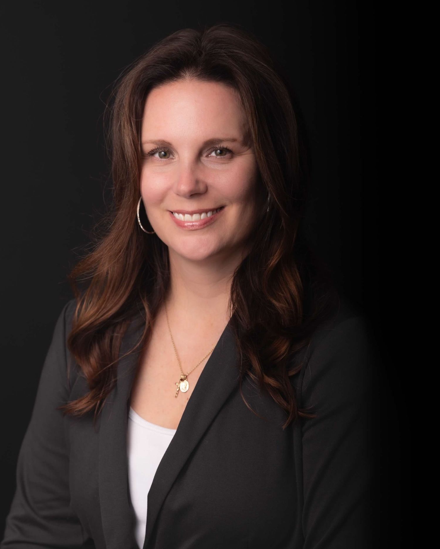 Professional studio headshot of woman on black background, ninefifteenphoto Meade County KY headshot photographer.