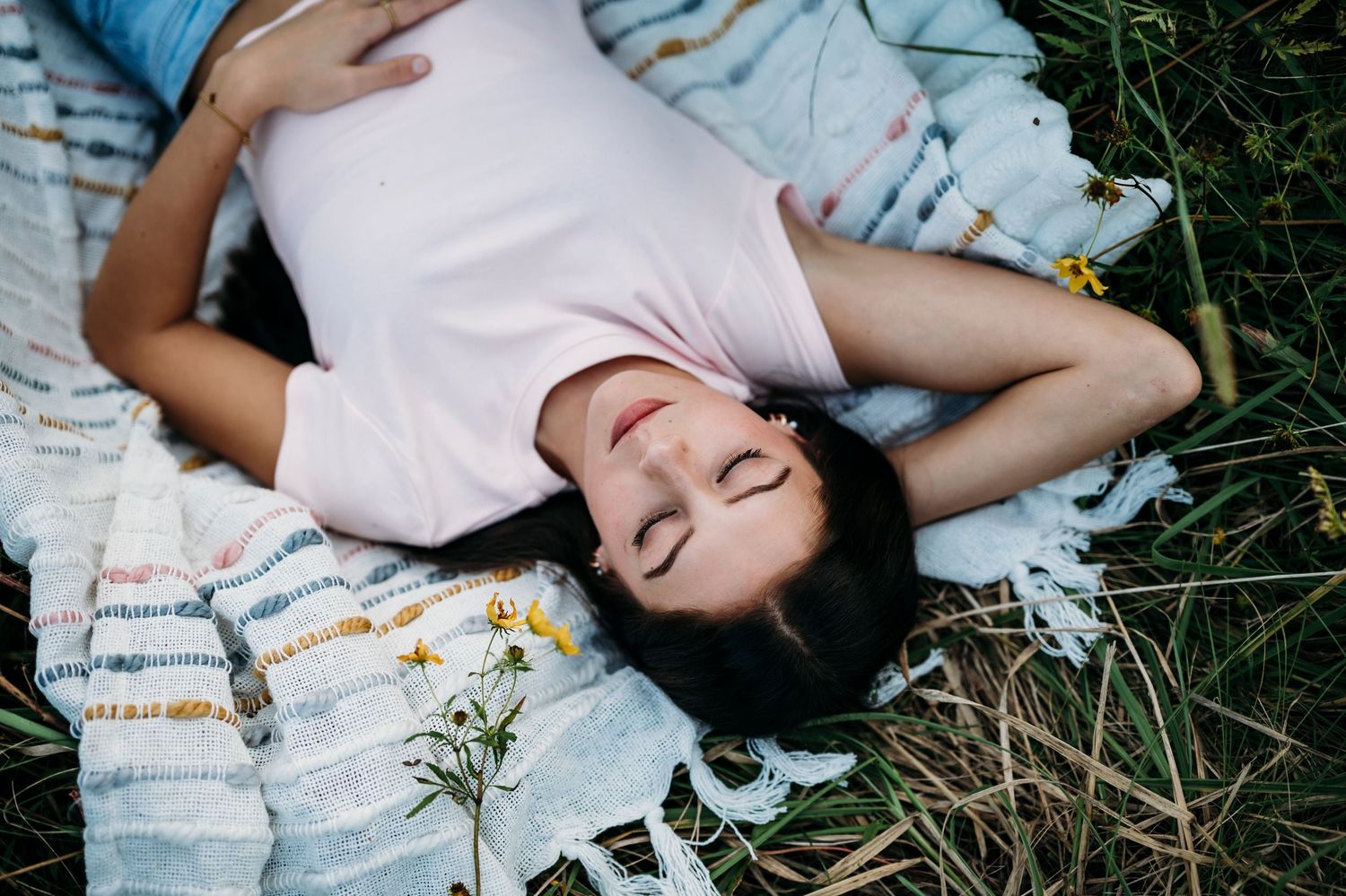 Emily laying on a blanket during her golden hour senior session at Otter Creek Park in Brandenburg KY by ninefifteenphoto.