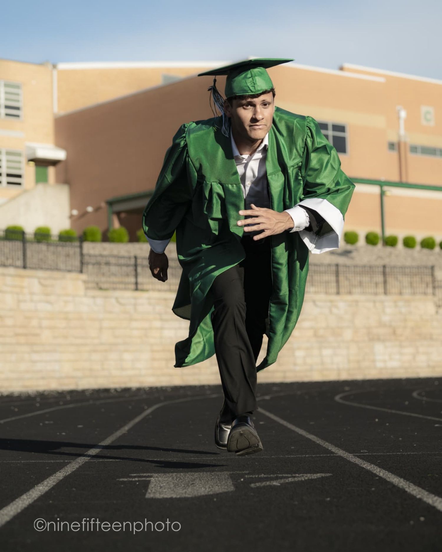 Senior graduation photo in cap and gown taken outdoors in Kentucky by ninefifteenphoto for Class of 2025.