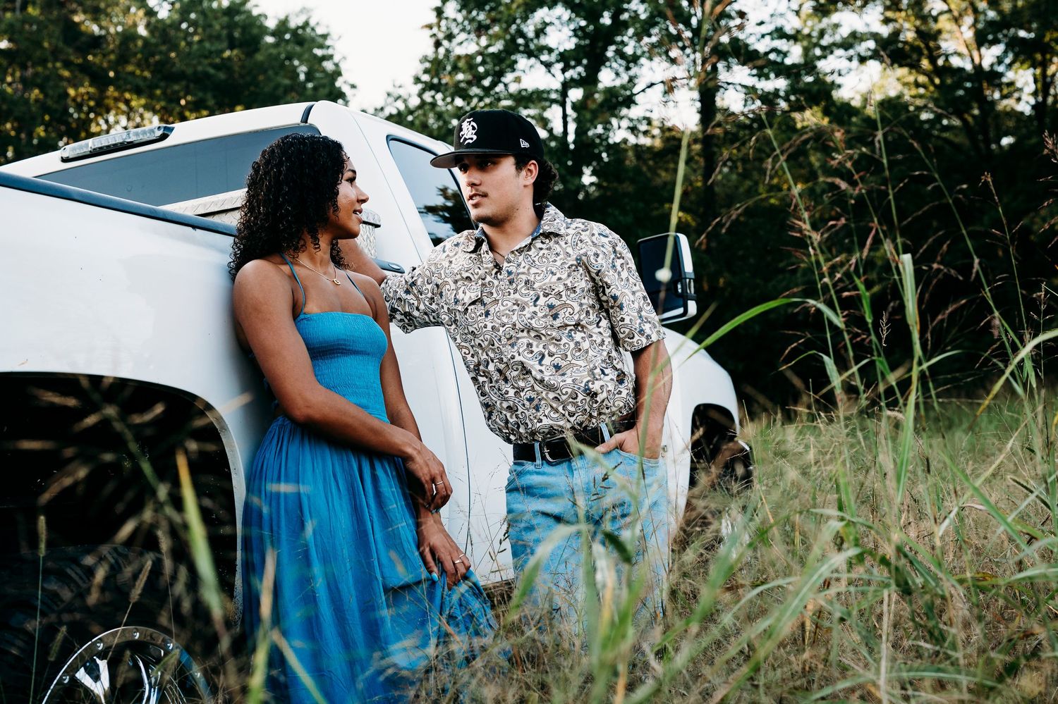 Bella and her boyfriend laughing by white truck during Brandenburg KY senior session by ninefifteenphoto