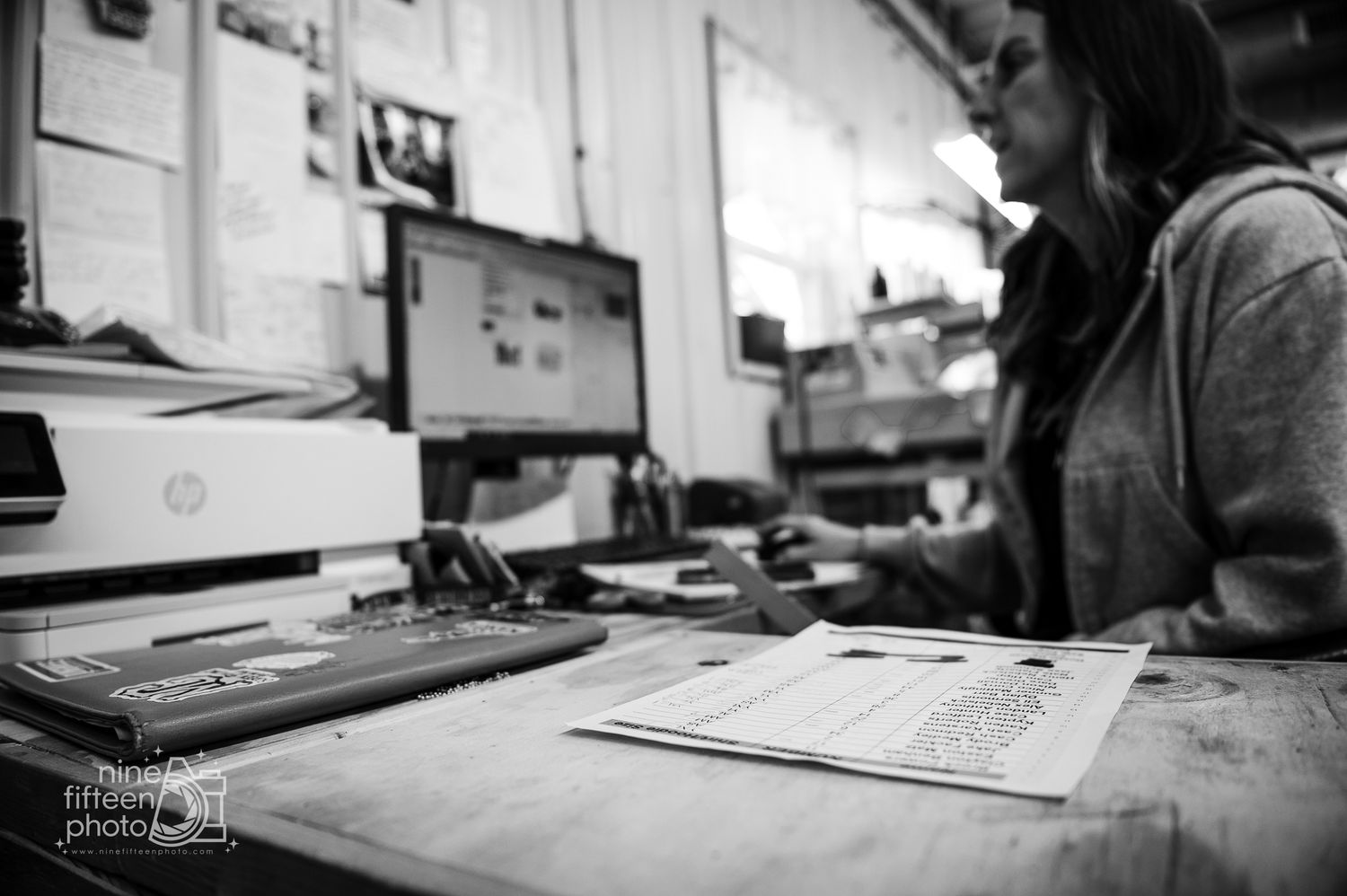 Graphic designer creating MCF logo design at MC Screen Printing in Brandenburg photographed by ninefifteenphoto.