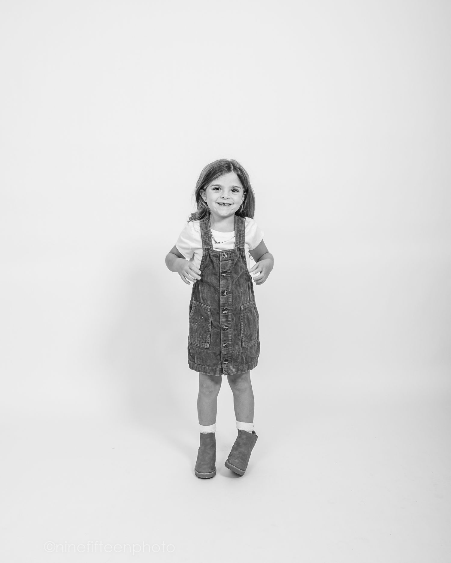 Minimalist collage of studio personality portraits designed as a white background phone wallpaper featuring a child photography session