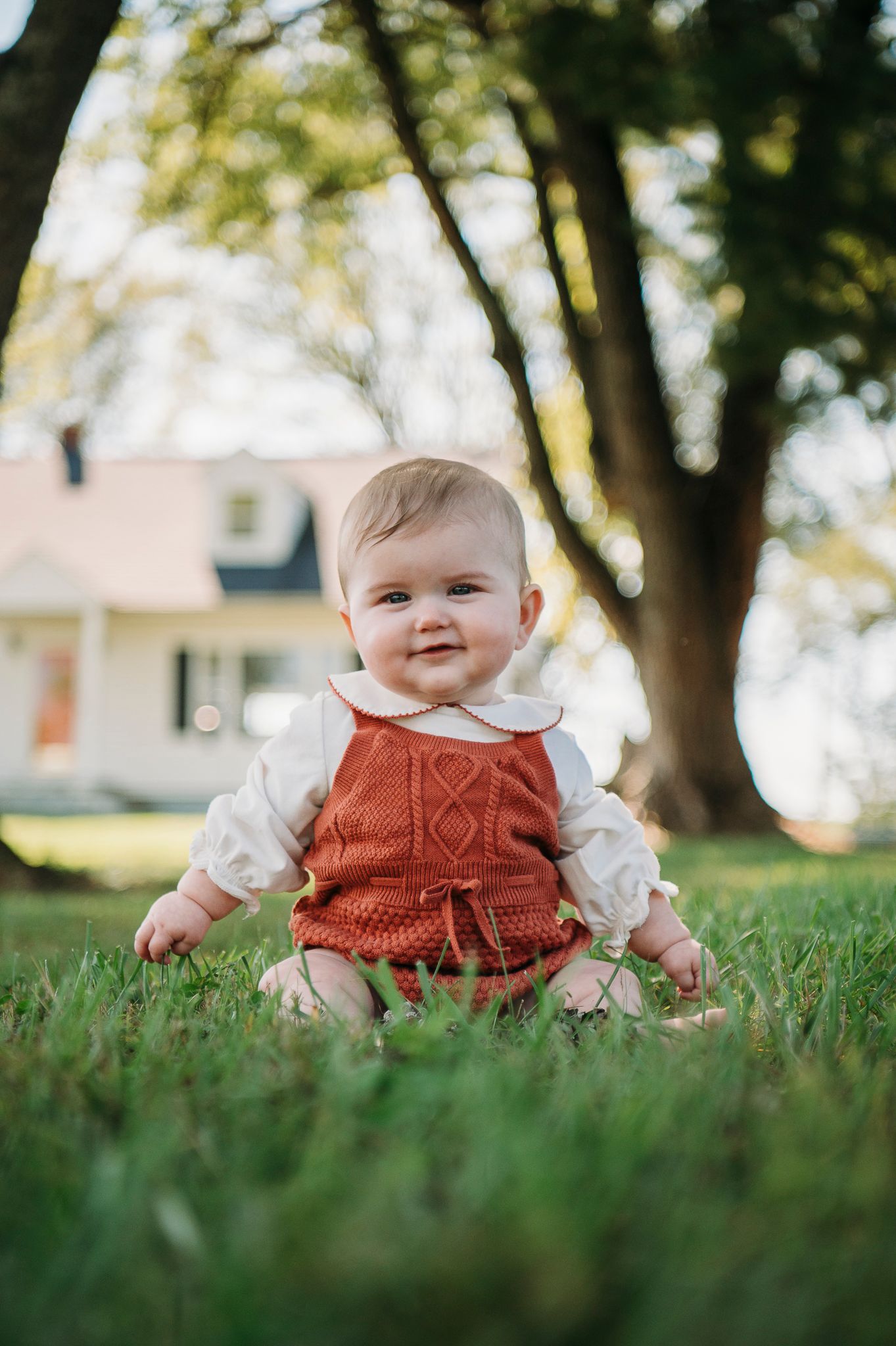 8-month-old baby smiling during a farmhouse family photo session in Battletown Kentucky by ninefifteenphoto