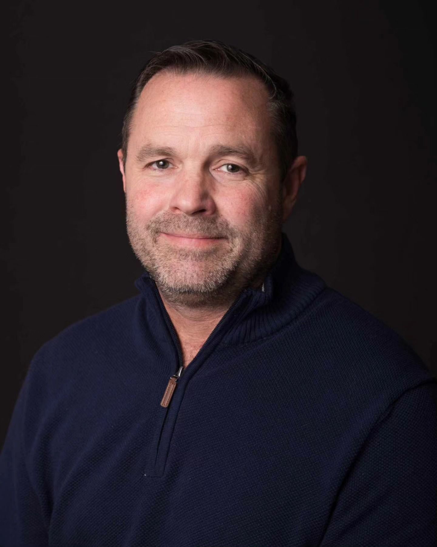 Studio headshot of man on dark background, ninefifteenphoto Meade County KY professional headshot photographer.