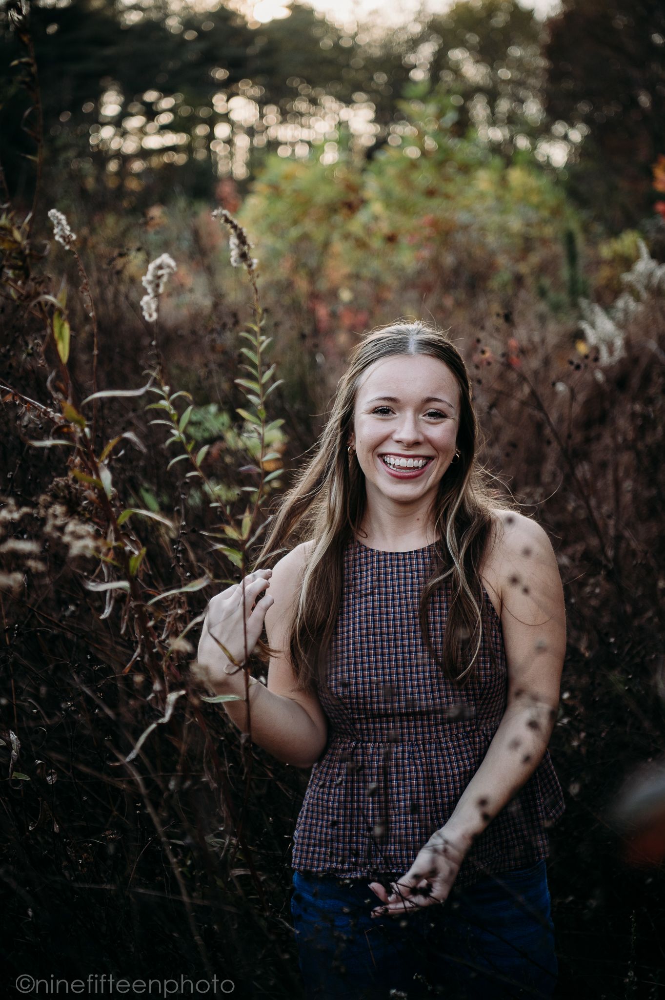 Fall senior photos of a high school girl captured by ninefifteenphoto in Brandenburg KY, featuring golden light, colorful leaves.