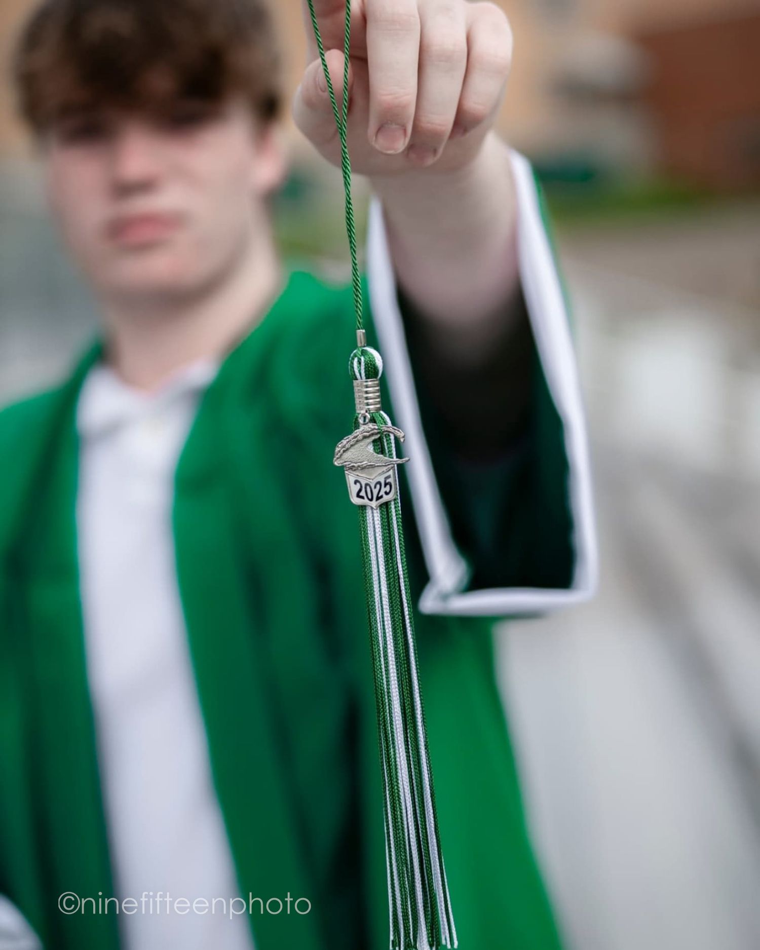 Senior graduation photo in cap and gown taken outdoors in Kentucky by ninefifteenphoto for Class of 2025.