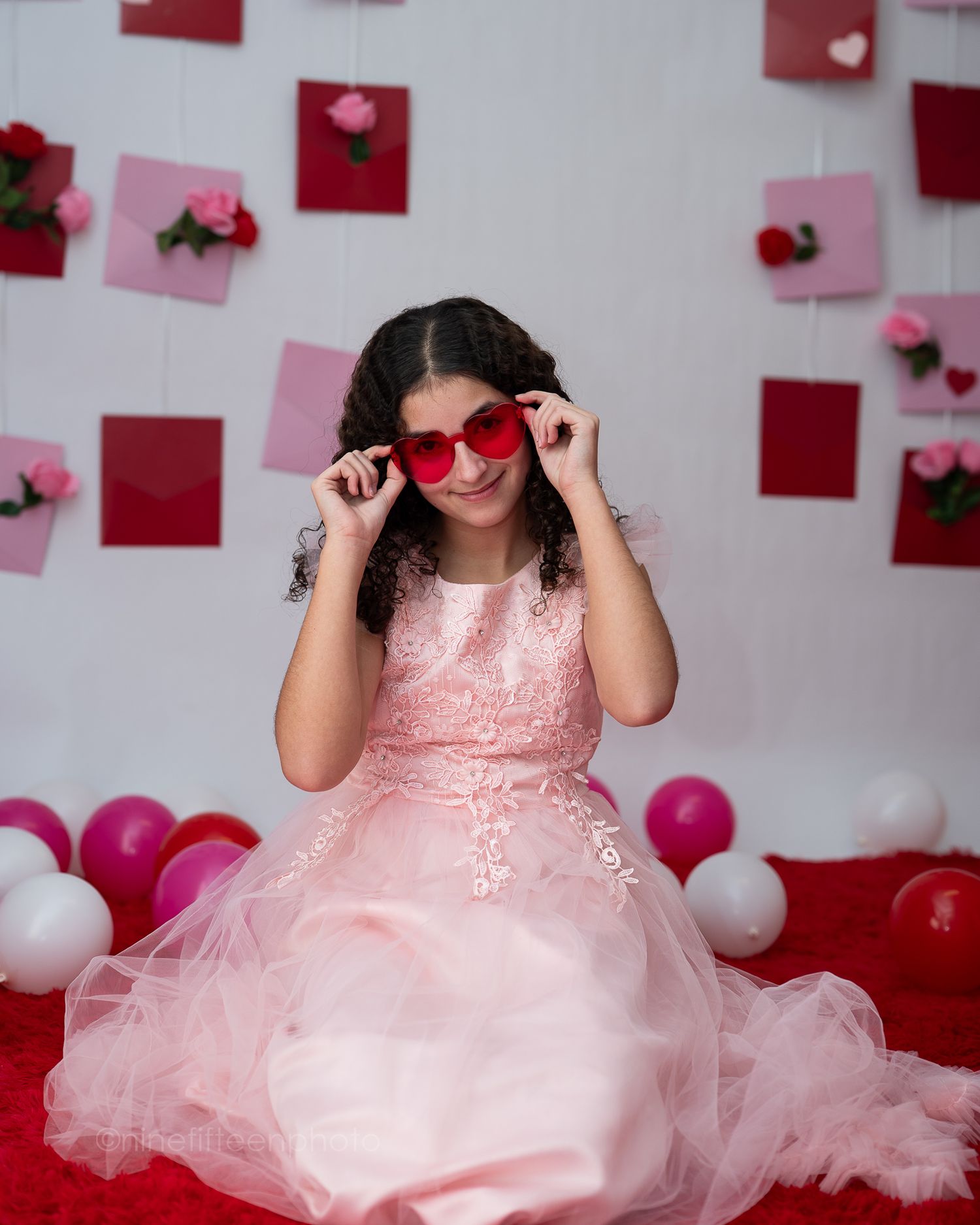 Valentine mini session with girl in pink dress and heart backdrop, ninefifteenphoto Brandenburg KY kids photographer.