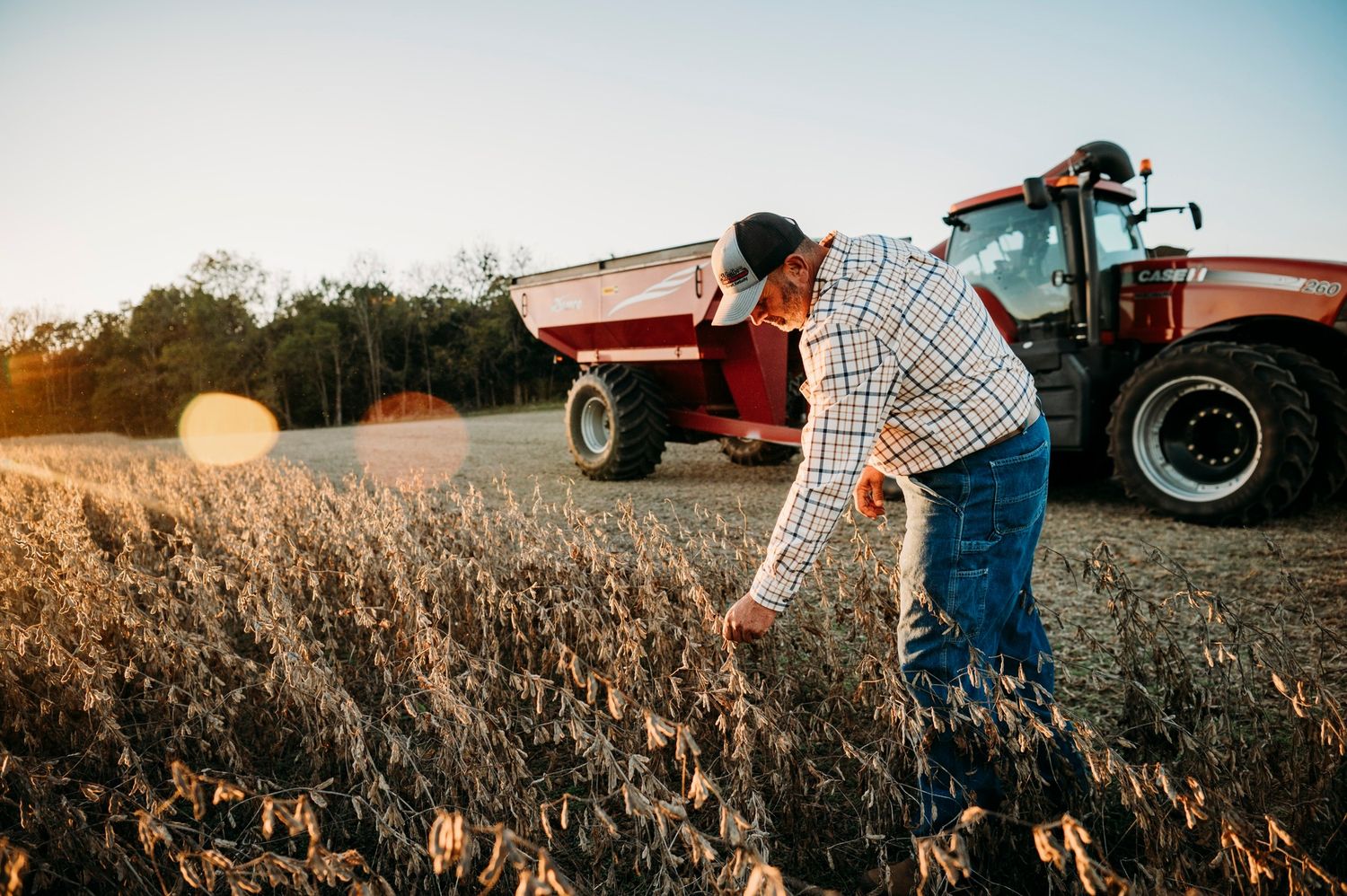 Golden hour farm senior portrait with tractor, ninefifteenphoto Brandenburg KY senior photographer in Meade County.