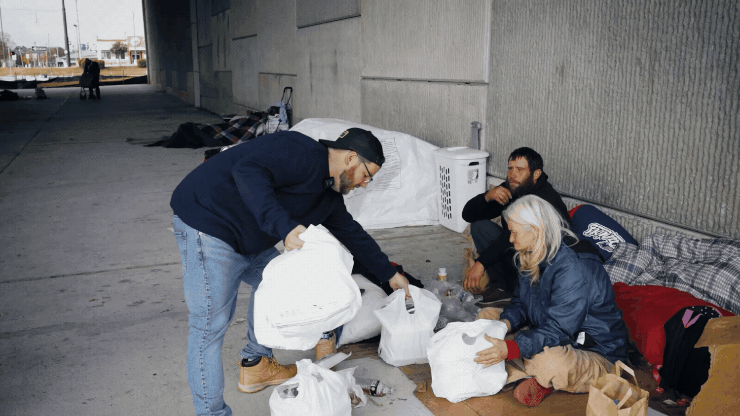 Video of a nonprofit staff member delivering meals to the homeless in North Little Rock, Arkansas.