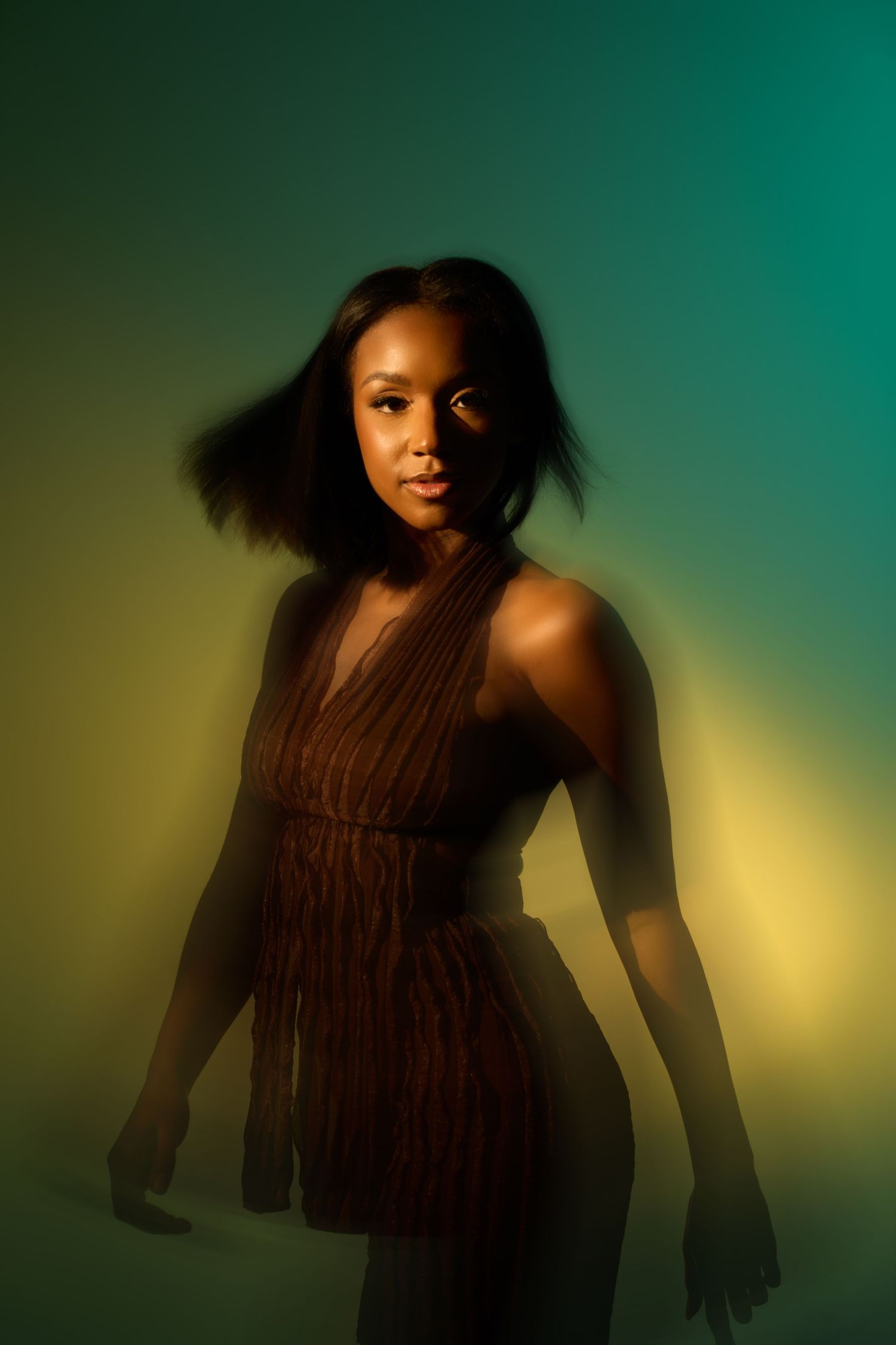 Artistic portrait series with dramatic lighting against teal and yellow backdrop.