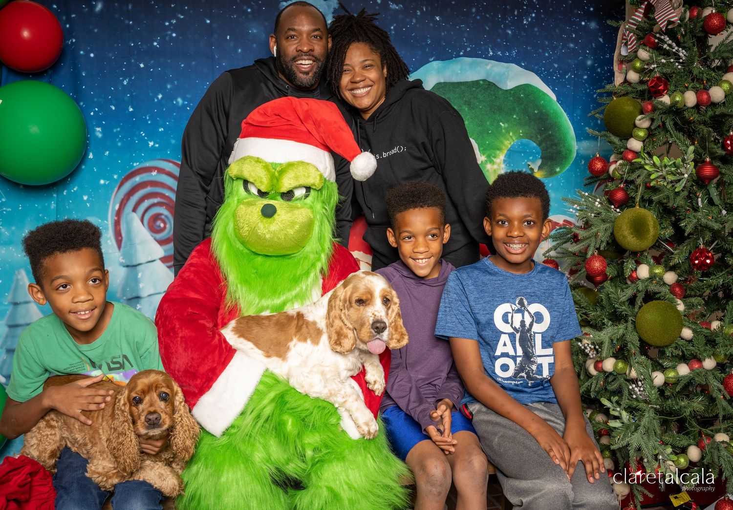 Holiday photo session with the Grinch character and festive Christmas decorations.