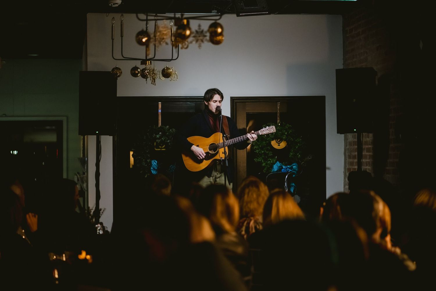 Concert venue with stage lighting and acoustic performance.