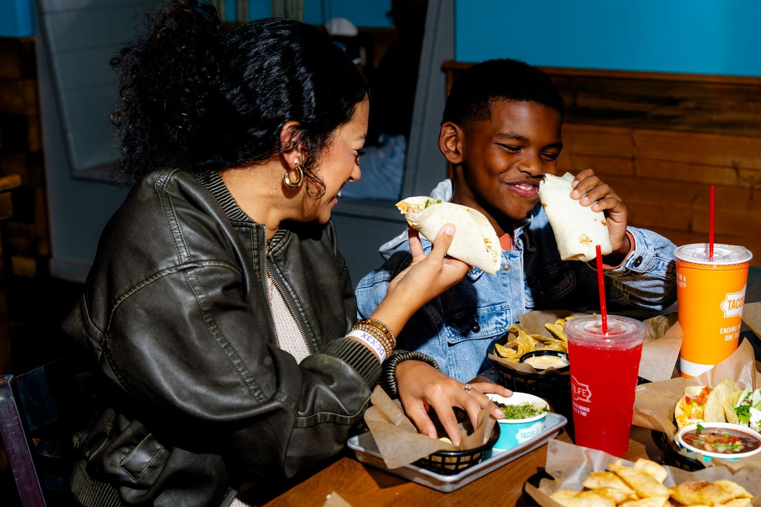 Group dining experience at casual restaurant with drinks and food.
