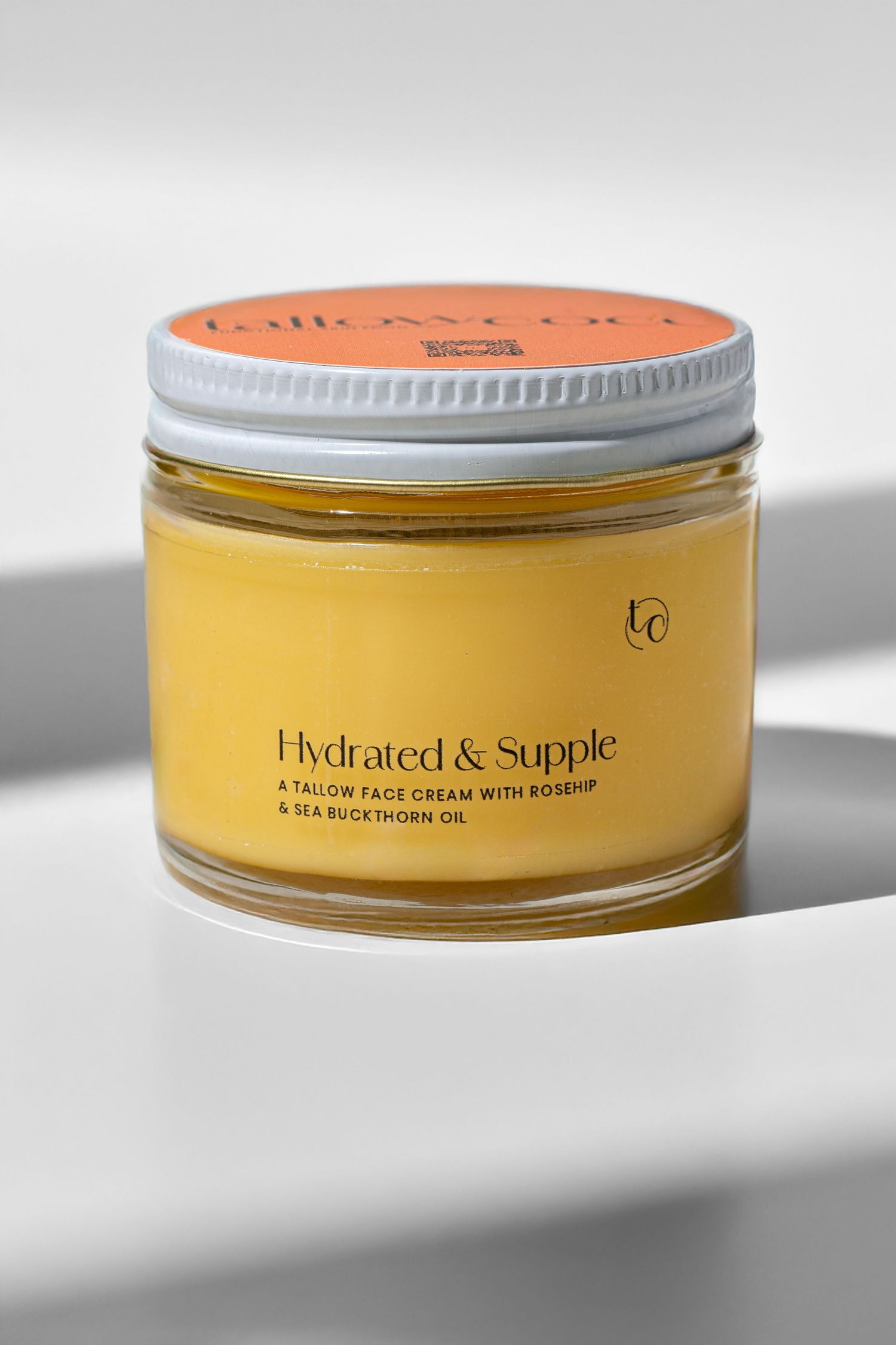 Yellow cosmetic jar with silver lid photographed from multiple angles.