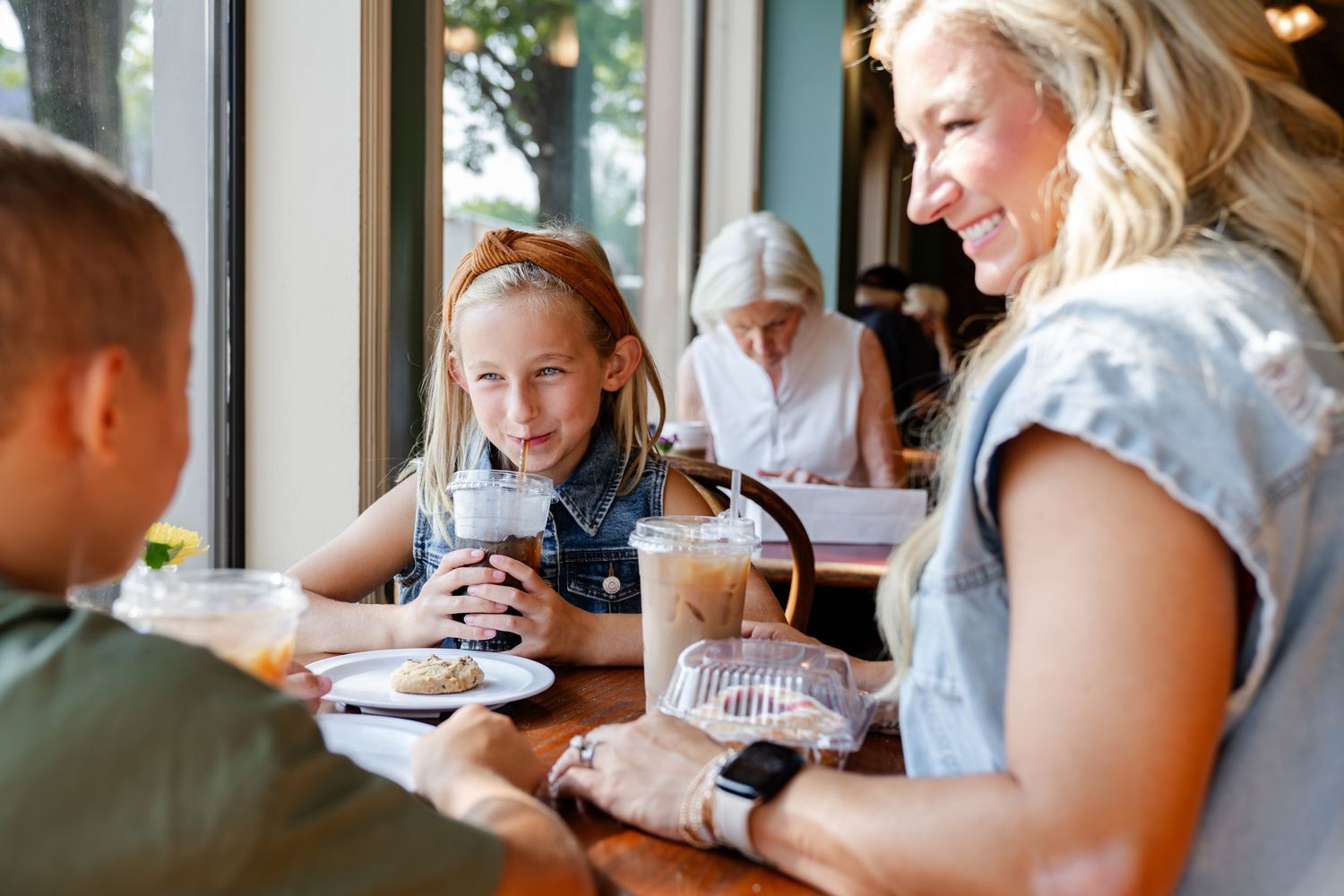 People gathered around a table enjoying a casual meal together.