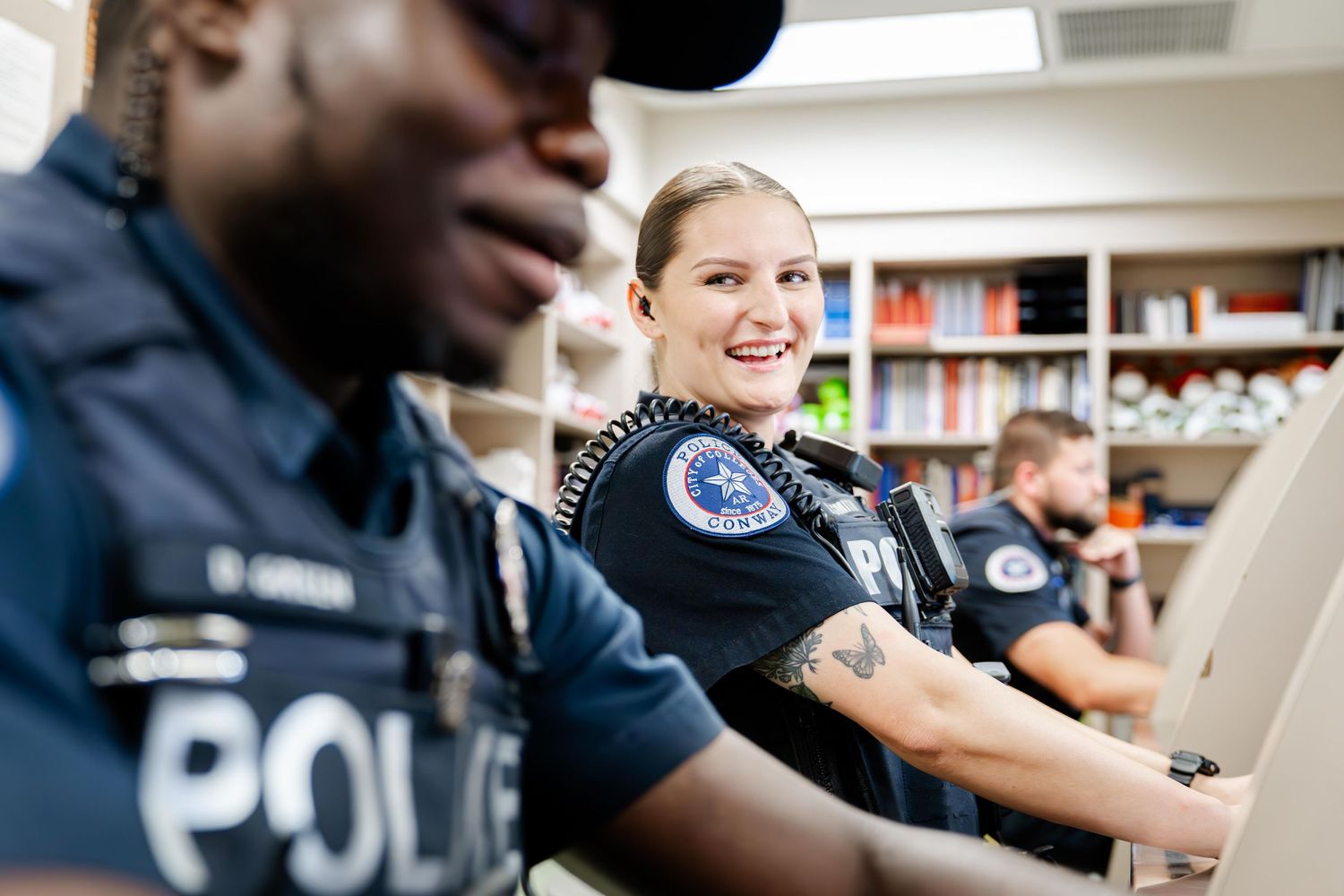 Law enforcement officers engaged in discussion during a training session.