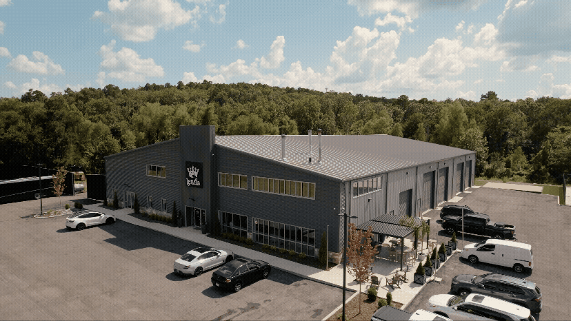 Aerial drone view of a business building called Leiva's Coffee for a branding video.