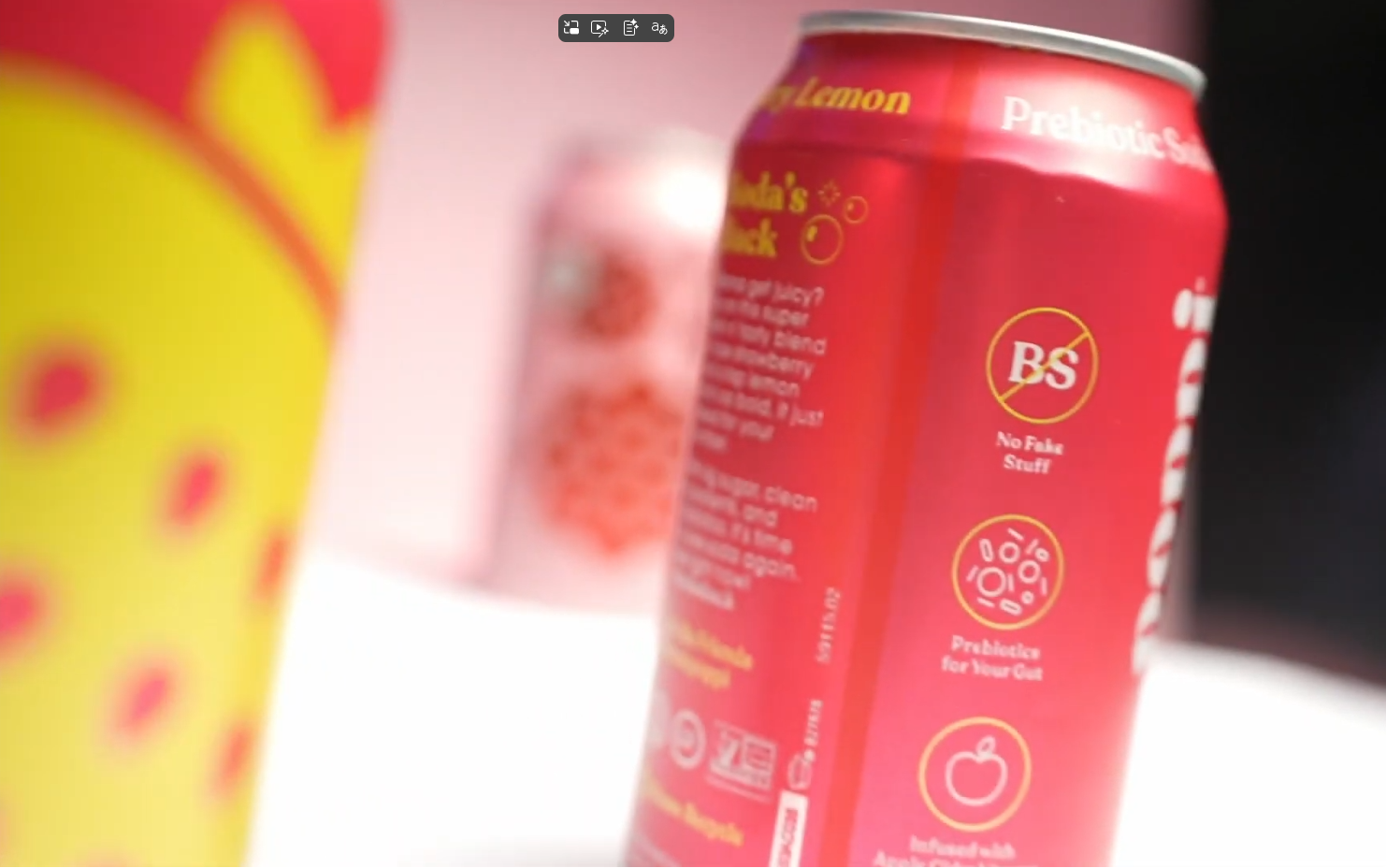 Row of pink beverage cans with minimalist design on black background. drink poppi