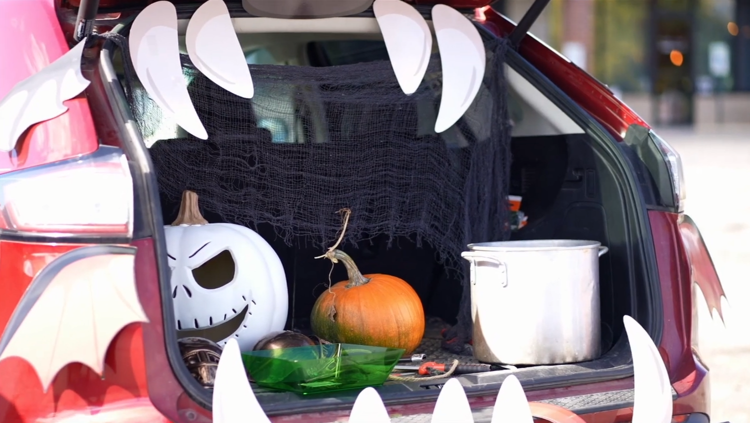 Halloween trunk or treat car decorated with spooky monster face and pumpkins. trunk or treat ideas