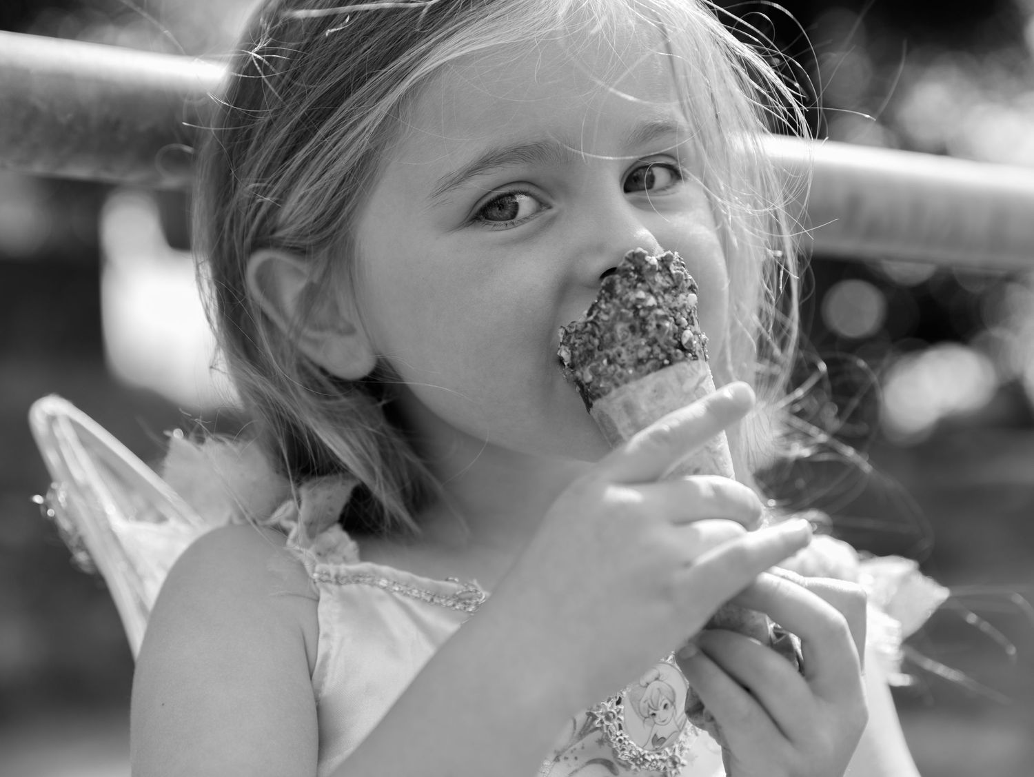 A magical moment with sparkles and fairy wings captured in black and white.
