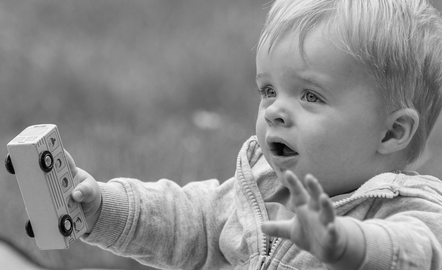 Black and white close-up photo showing joyful expressions and smiles.