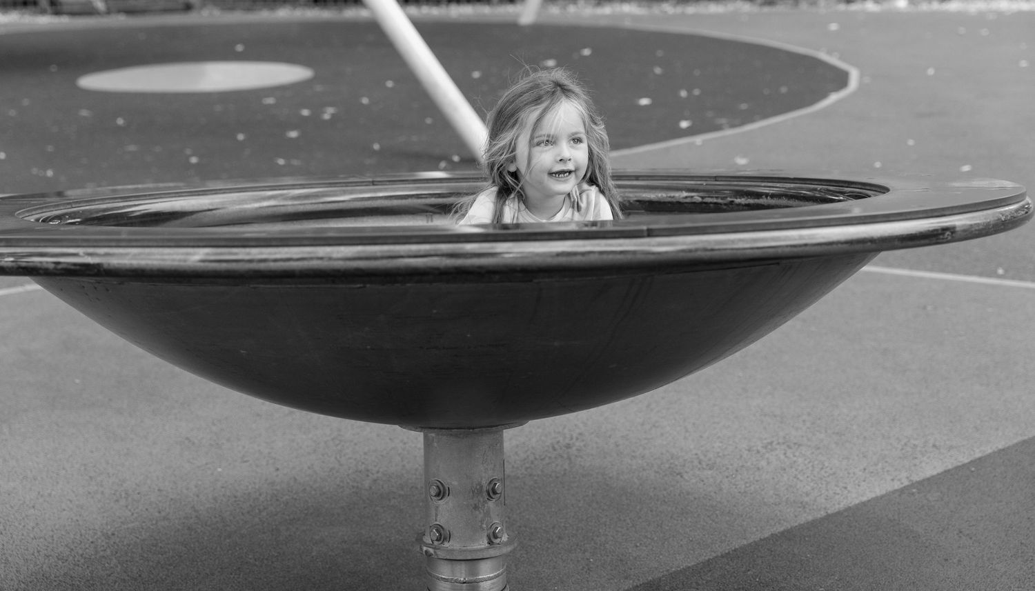 A sequence of black and white photographs showing someone performing skateboarding tricks on a curved ramp surface.