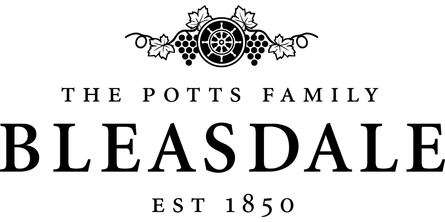 Vintage black and white decorative header with ornate scrollwork design for The Potts Family Bleasdale business.