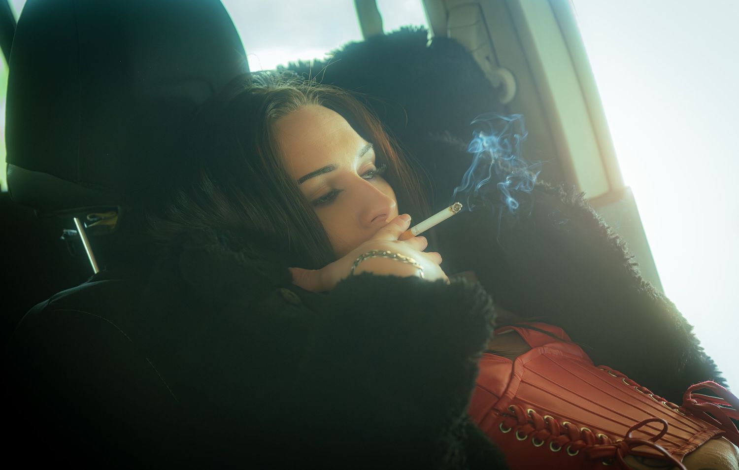 Moody atmospheric photo series with dramatic lighting and dark tones in a car interior.