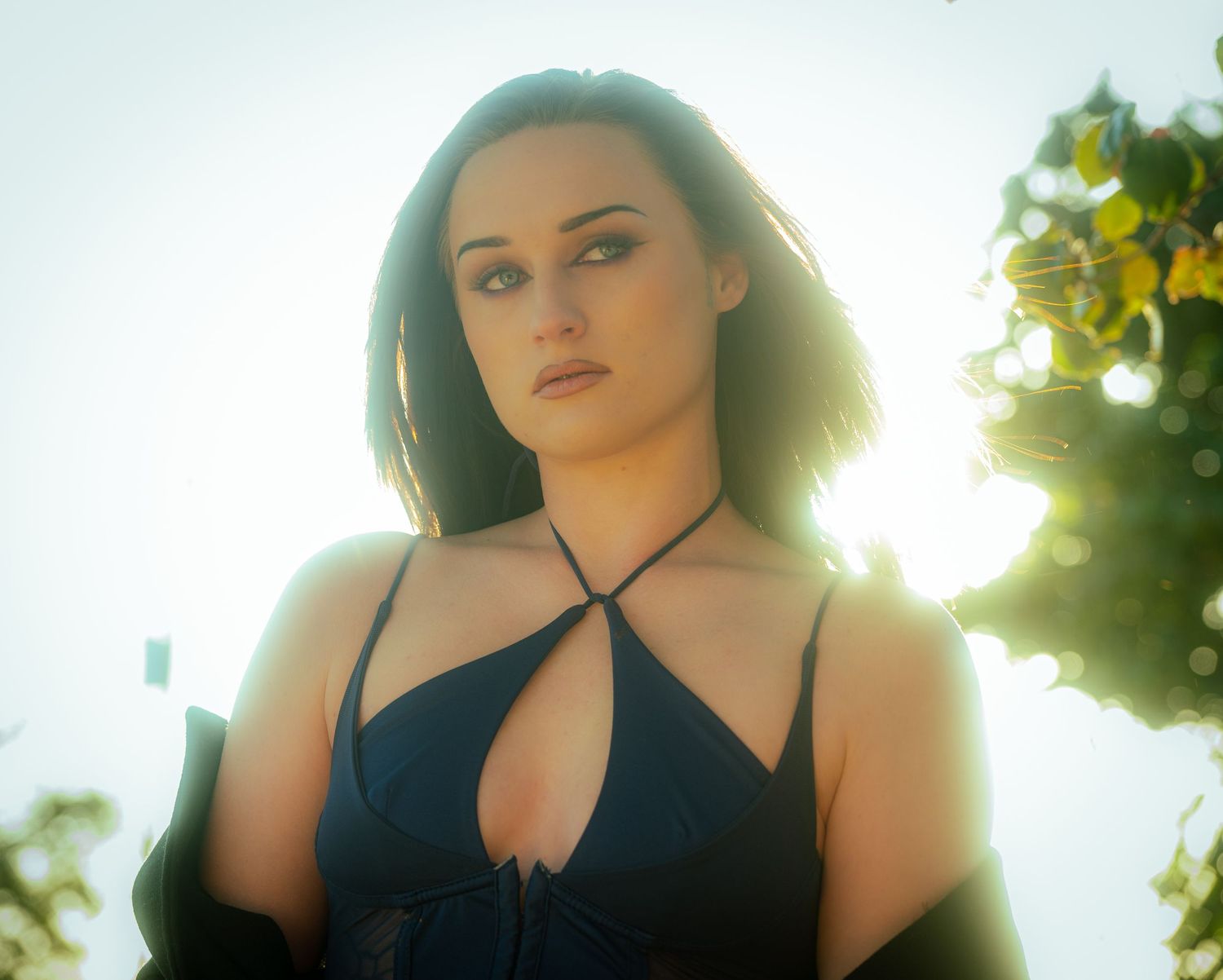 Backlit portrait series with natural sunlight creating golden glow effect.