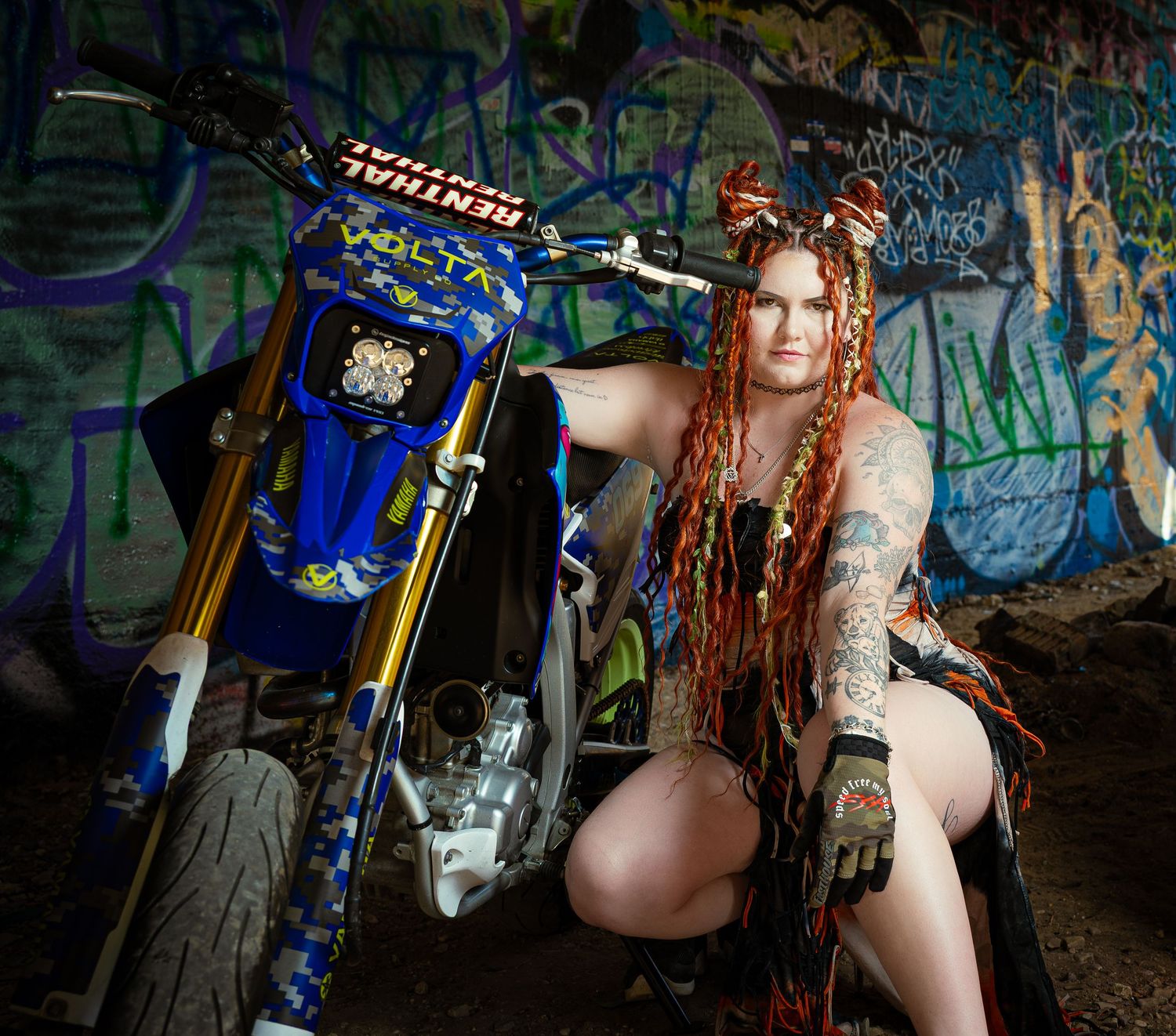 A steampunk-themed fantasy photoshoot featuring dramatic lighting and vintage mechanical props in a moody forest setting.