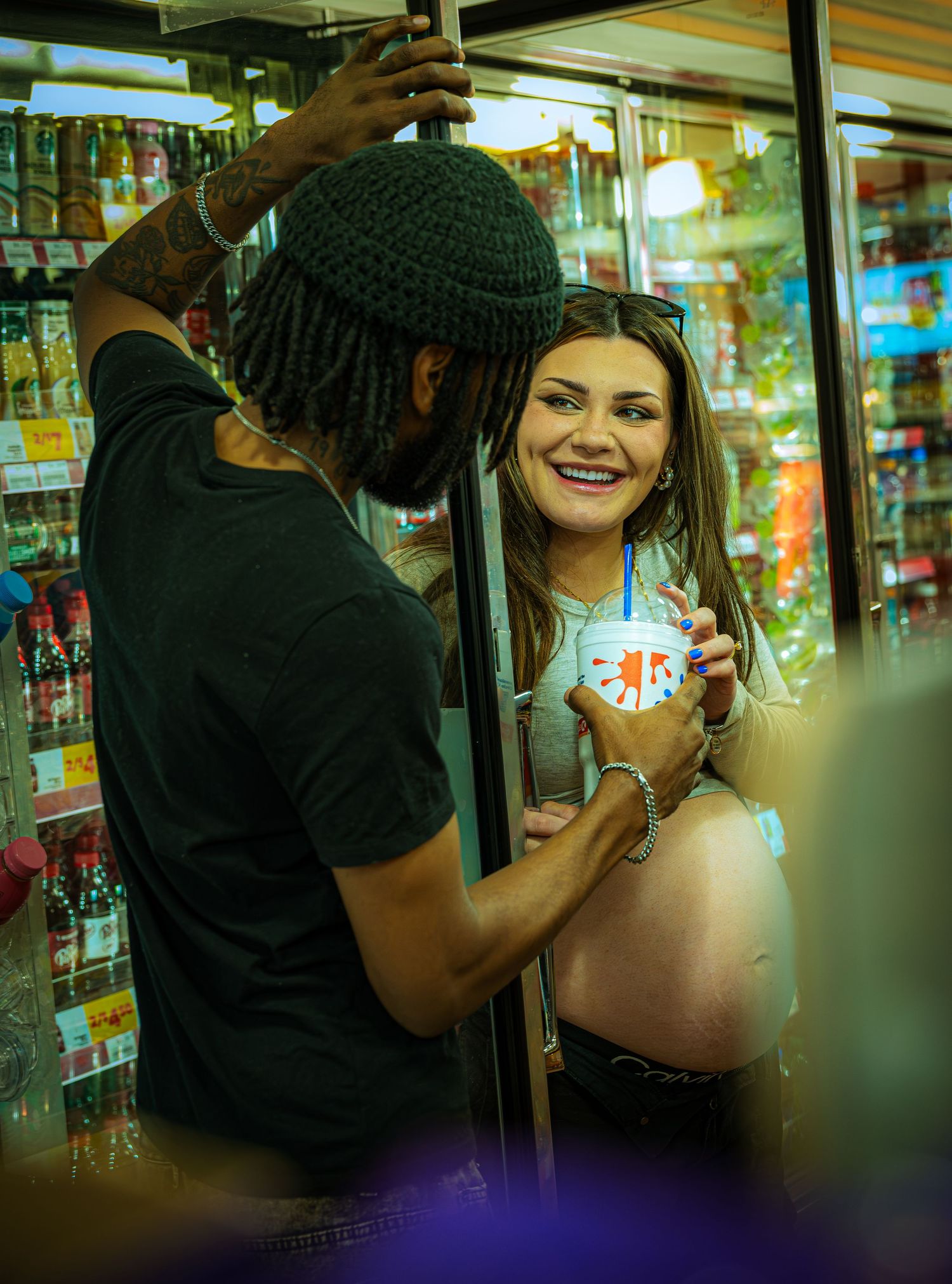 Three sequential photos show a couple laughing and sharing a playful moment in a store aisle.
