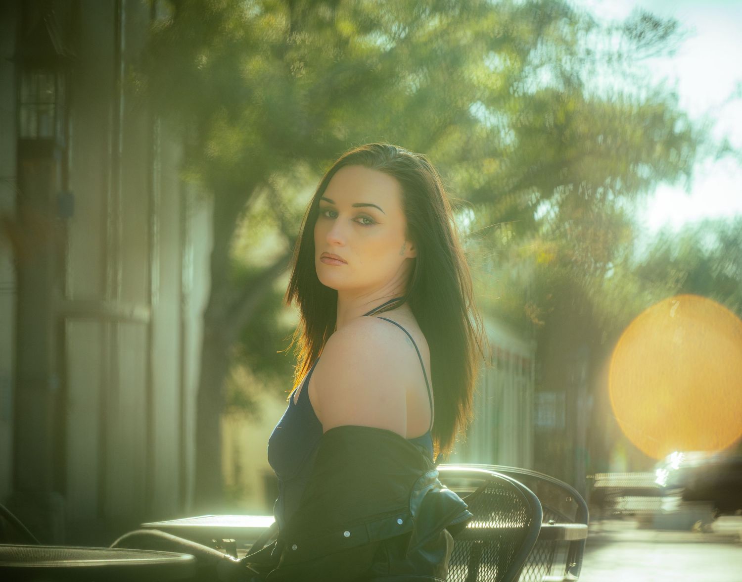 Artistic outdoor portrait series with soft focus and natural backlighting effects.