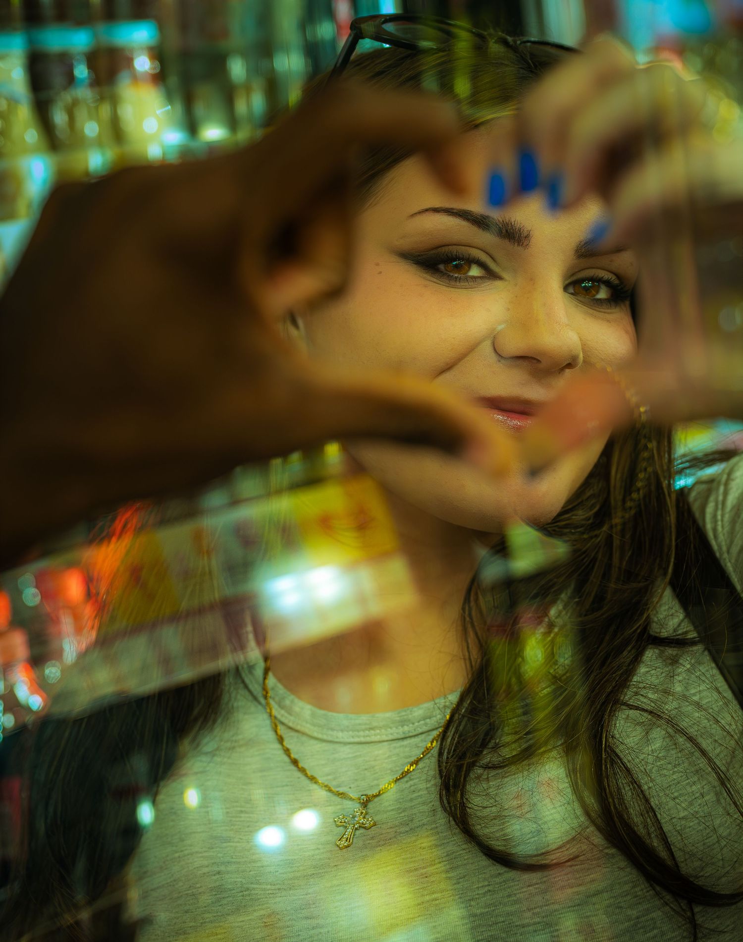 Artistic portrait with bokeh lights and warm tones creating a dreamy atmospheric effect.