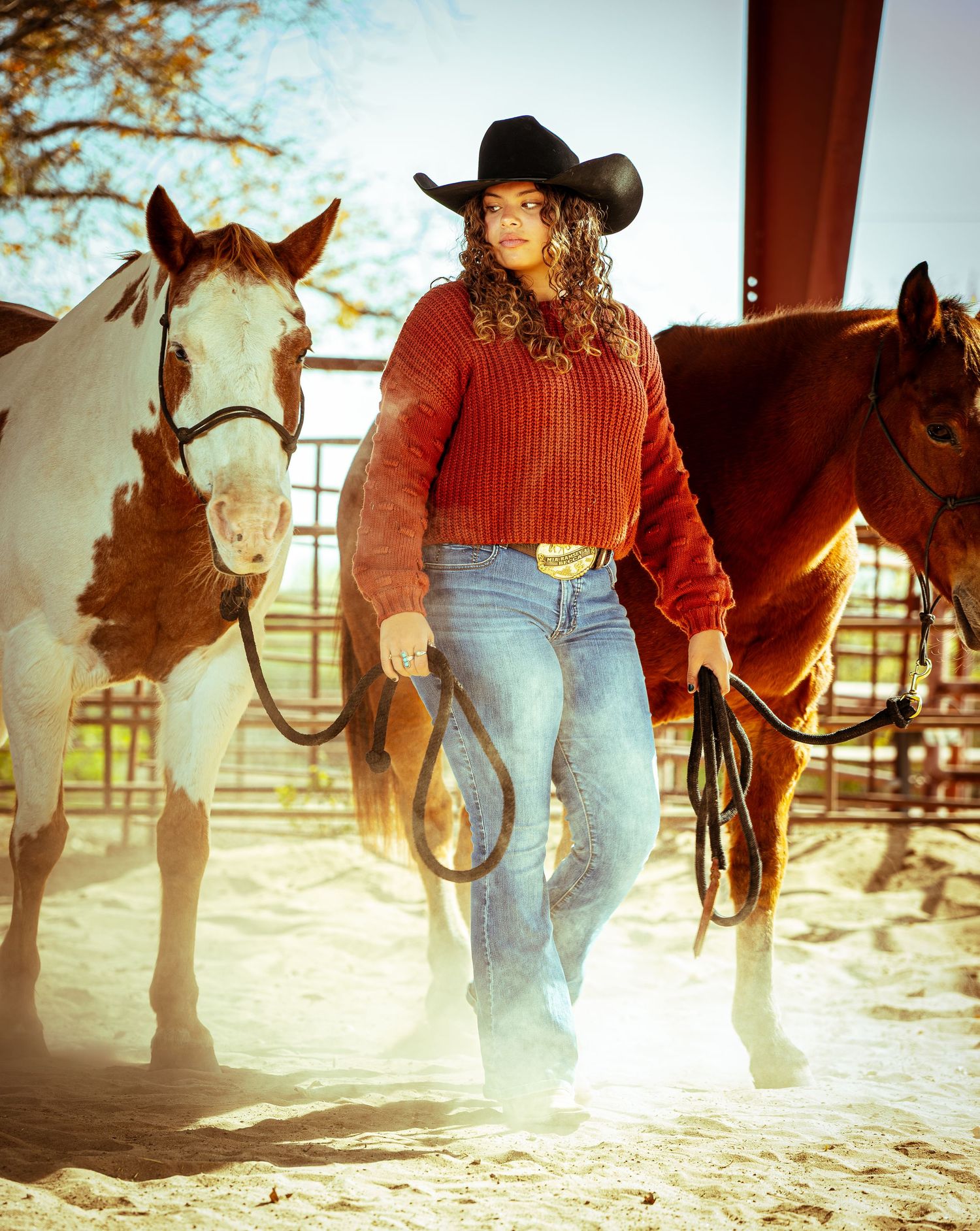 A sequence of cowboy boots and horse hooves kicking up dust in a rustic ranch setting during golden hour.