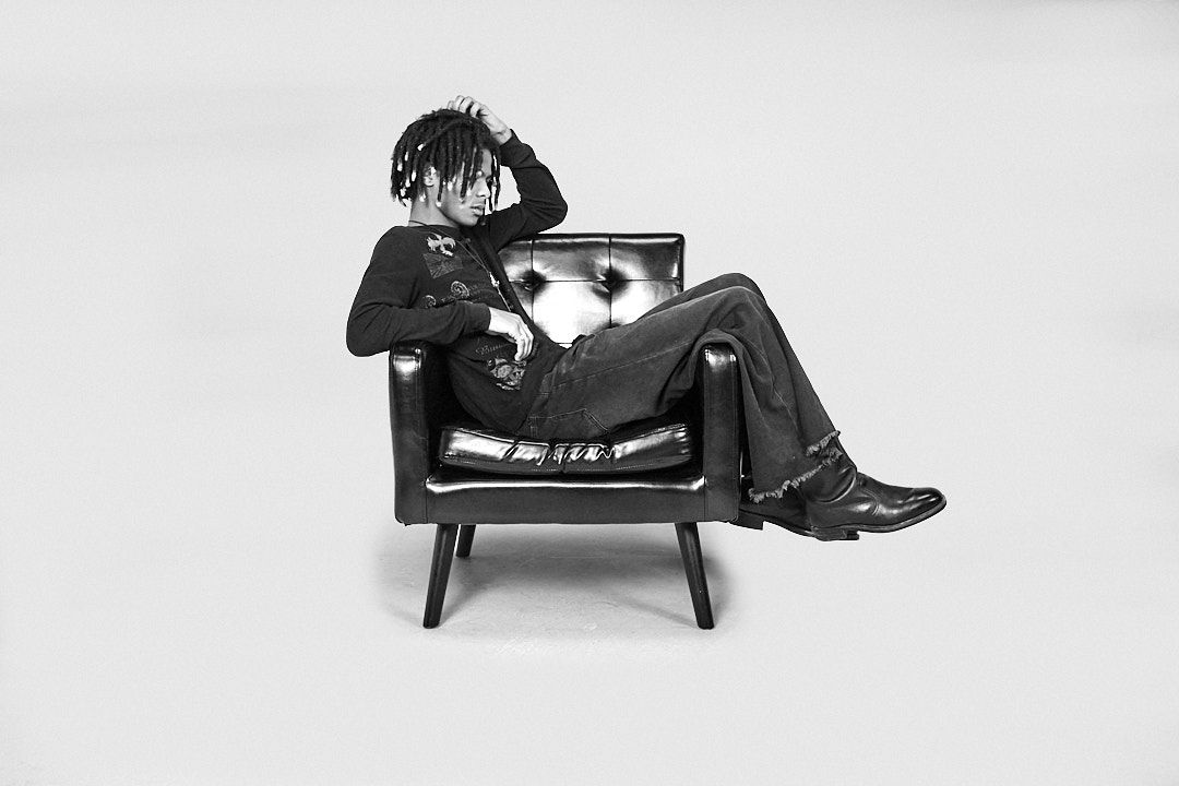 Artistic black and white photo series of lounging poses on modern furniture.