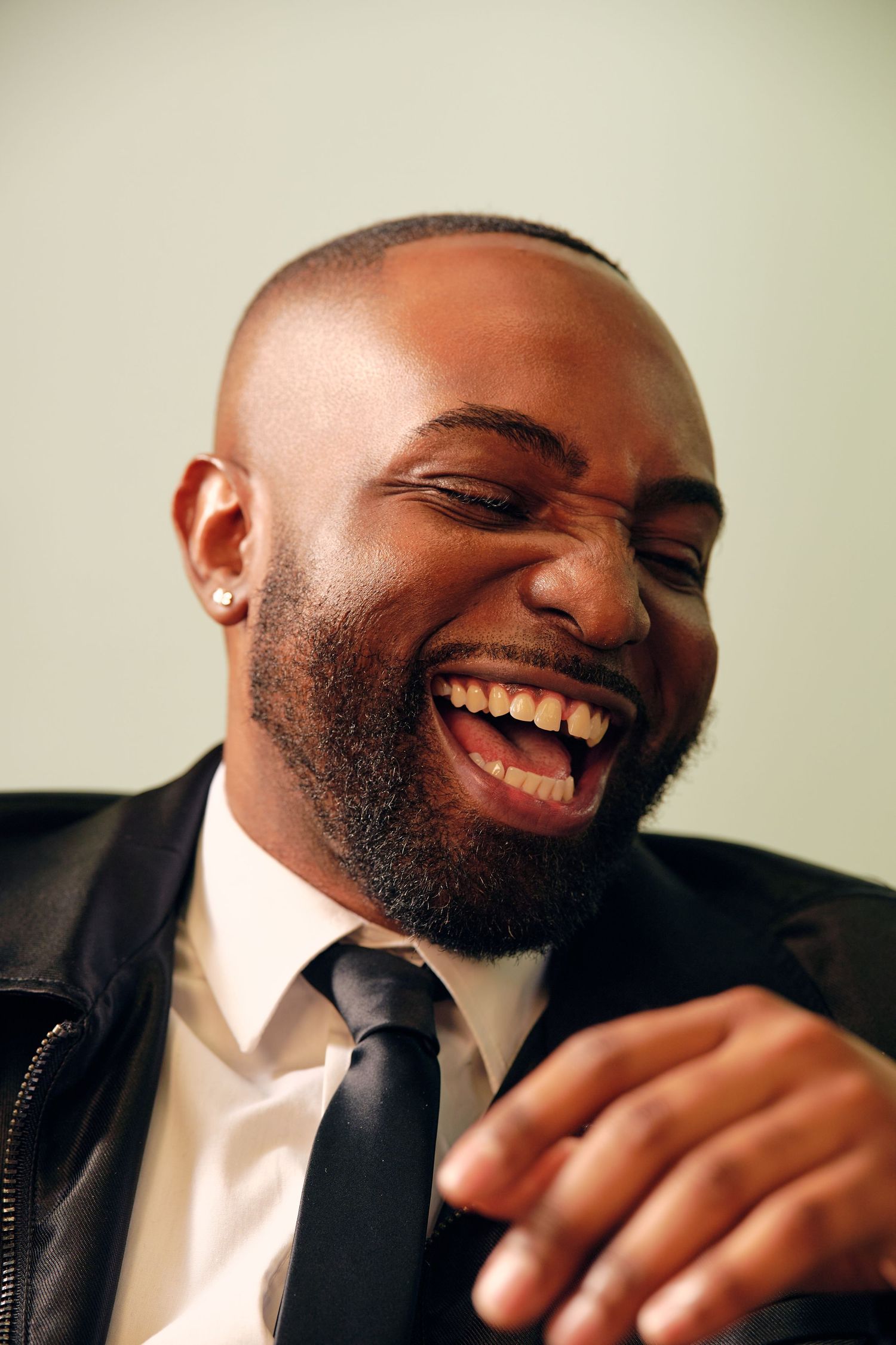 Professional portrait series capturing authentic moments of joy in business setting.
